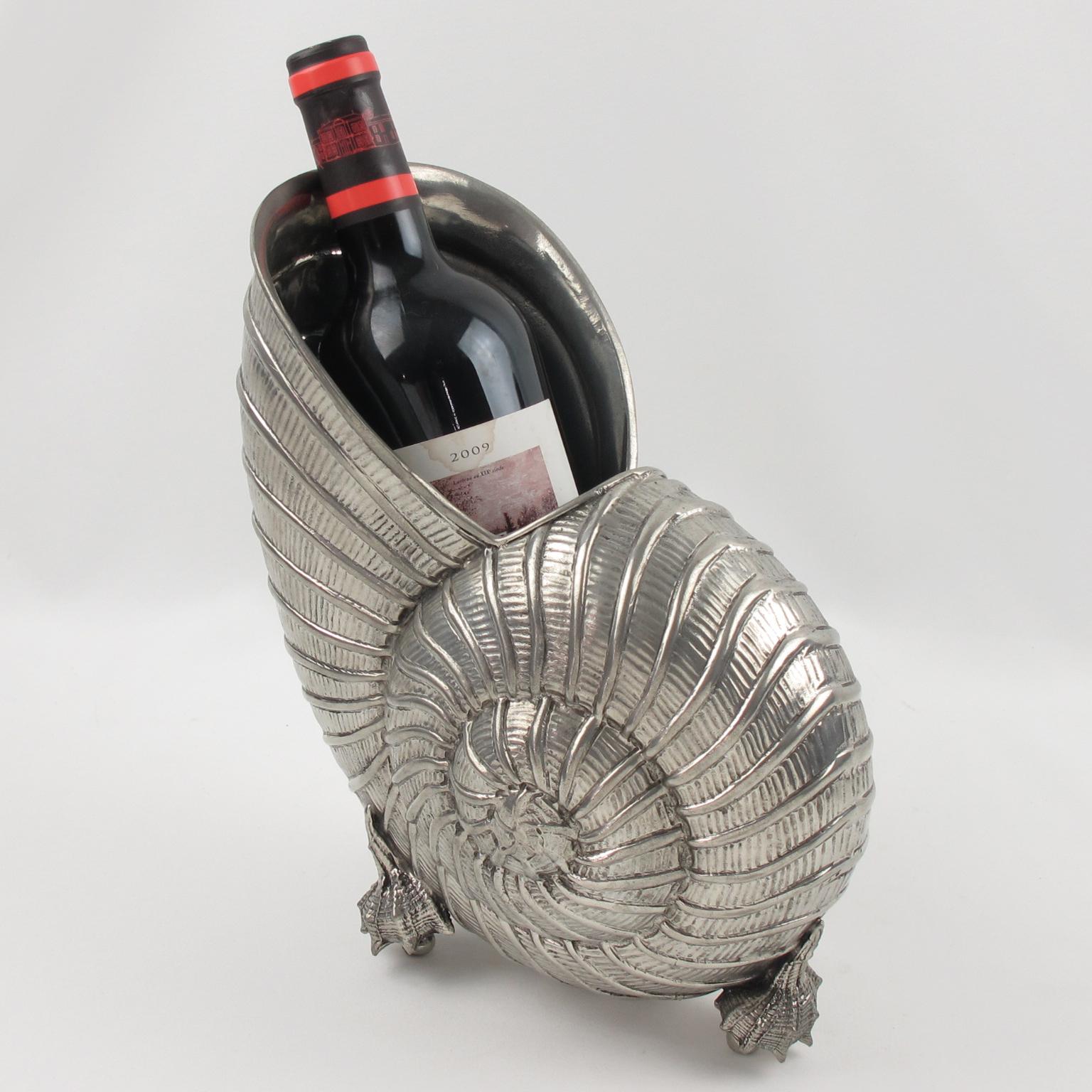 Stylish modernist chromed metal wine cooler or vase. This ultra chic bottle holder or champagne ice bucket features a whimsical sculpture of a large nautilus shell with three tiny seashells feet. Lots of character, bold lines and flawless