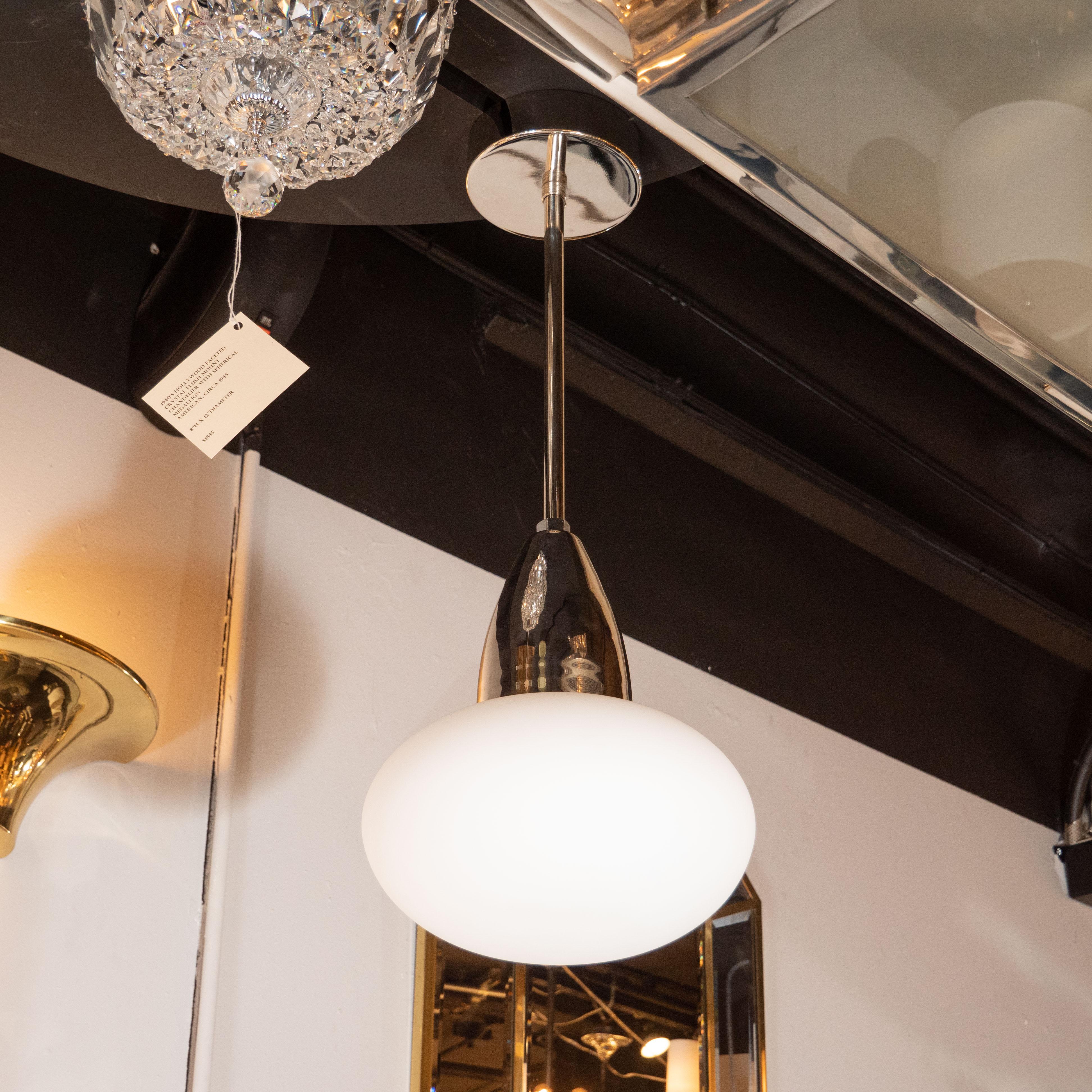 This modernist pendant was custom realized in the United States by our gallery atelier, High Style Deco. Employing hand blown Murano glass sourced from Italy, this stunning pendant combines the storied quality of artisanal Italian production with a