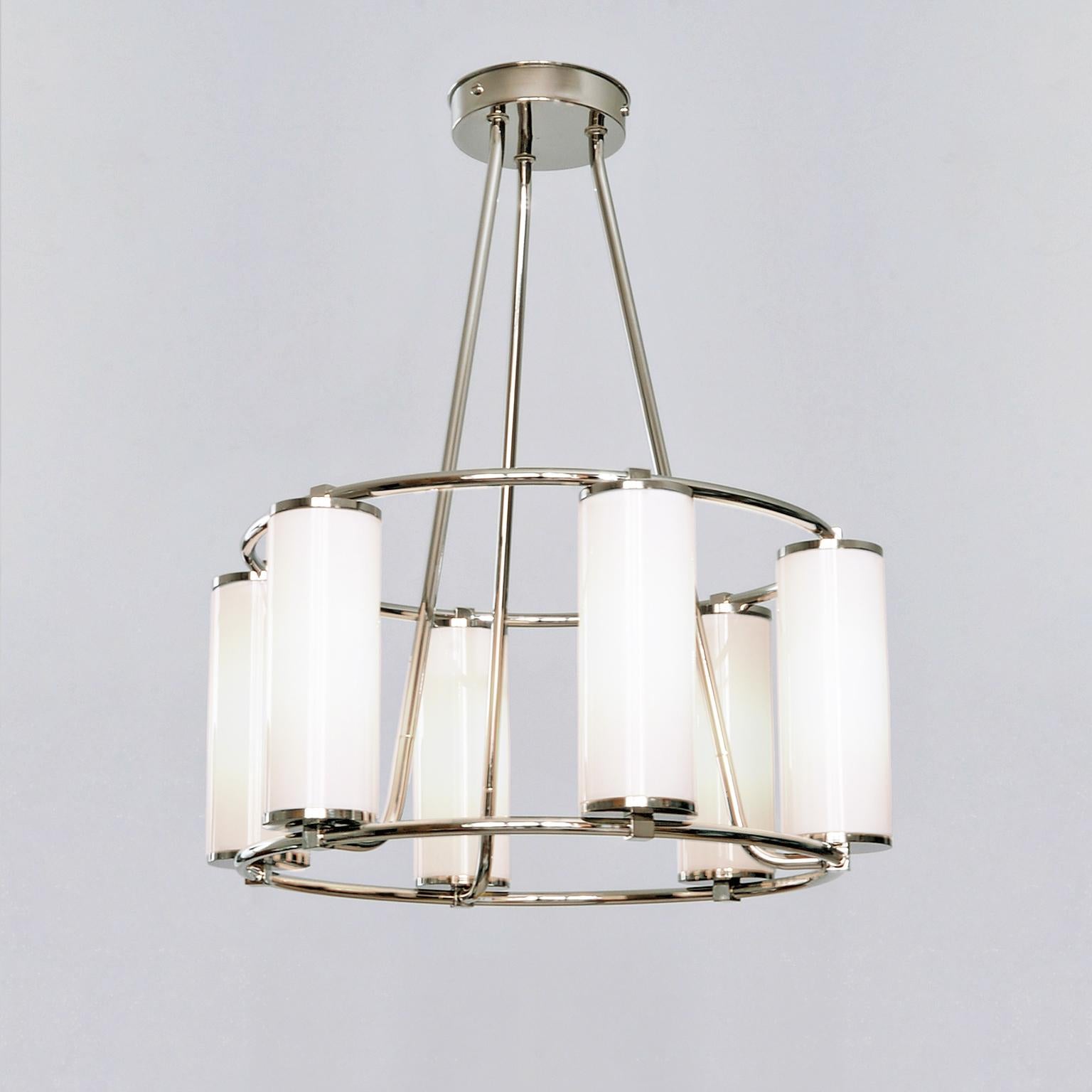 Modernist circular six-light 'Olympia' chandelier. Nickel-plated brass and opaline glass cylinders, manufactured by GMD Berlin. Hand made in solid brass, customizable. Also available in version with 3, 9 and 12 lights.

Technical details: 6 E 14