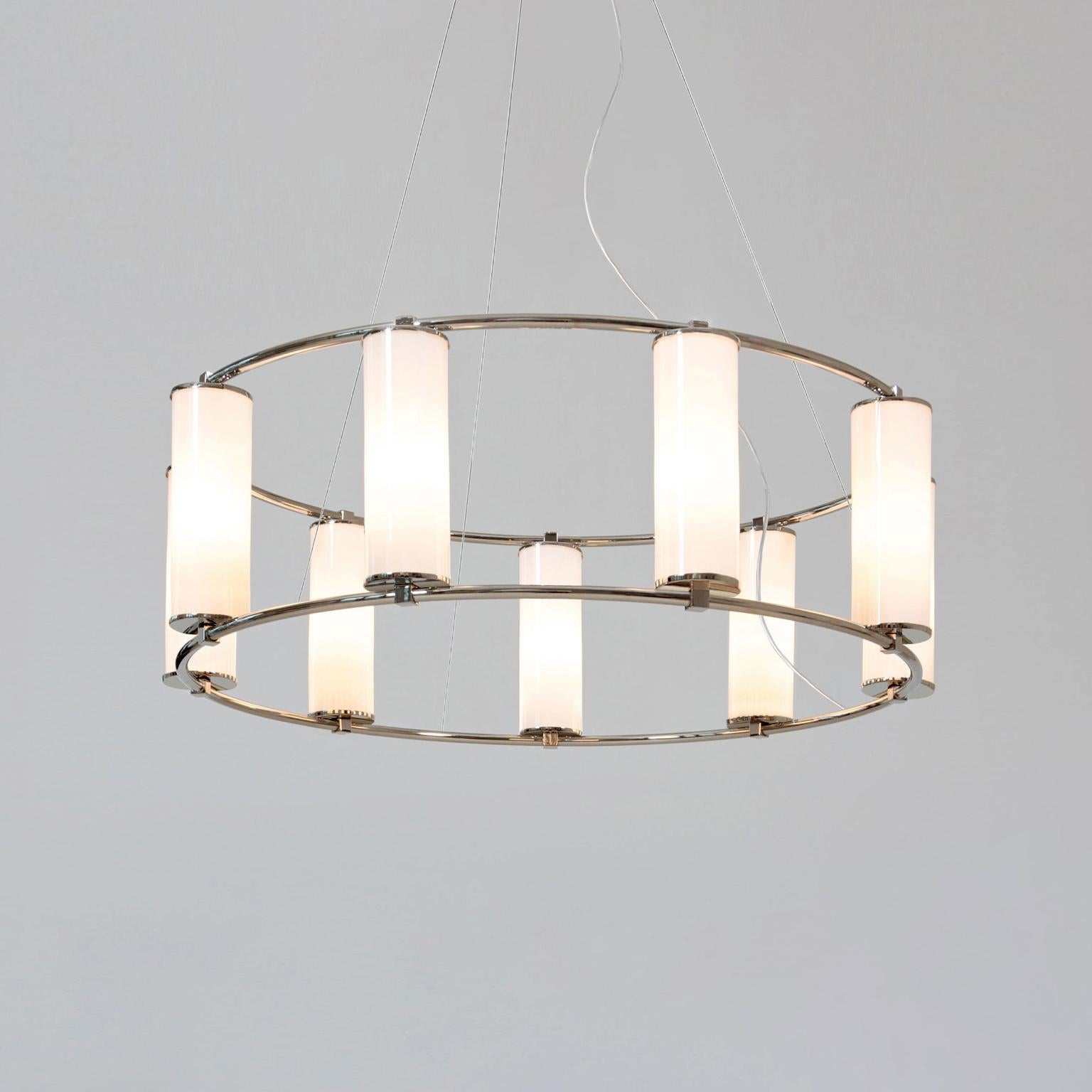 Modernist circular 9-light 'Olympia' chandelier. Nickel-plated brass and opaline glass cylinders, manufactured by GMD Berlin, 2018.

Technical details: 9 sockets E 27, pendant length is variable.