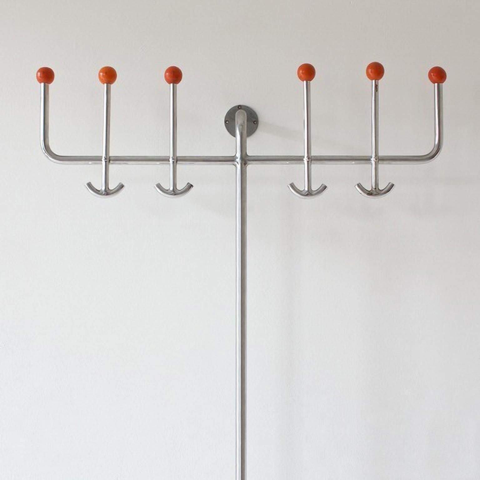 Modernist coat, hat and umbrella wall rack manufactured by Hynek Gottwald, circa 1930.
Chrome plated tubular steel, painted wood and metal. Extraordinary sculptural character and presence in the space.