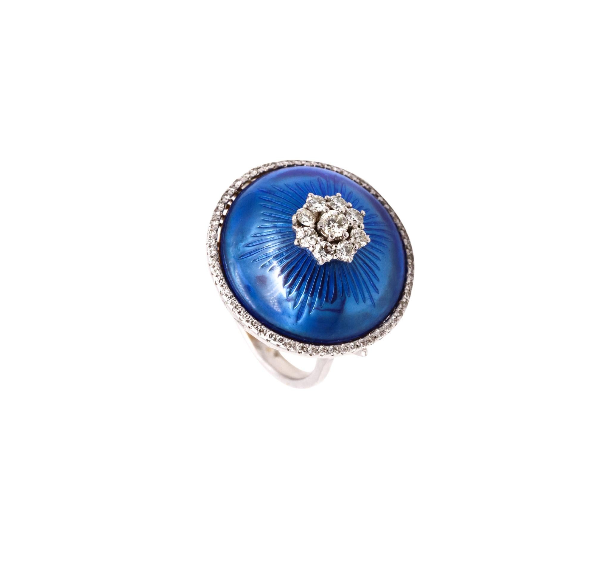 Jeweled domed cocktail ring with Blue Enamel.

Very handsome and colorful modernist piece, created in the early 1970's. It was carefully crafted in solid 18 karats white gold and finished, with very high polish.

The domed part is embellished with