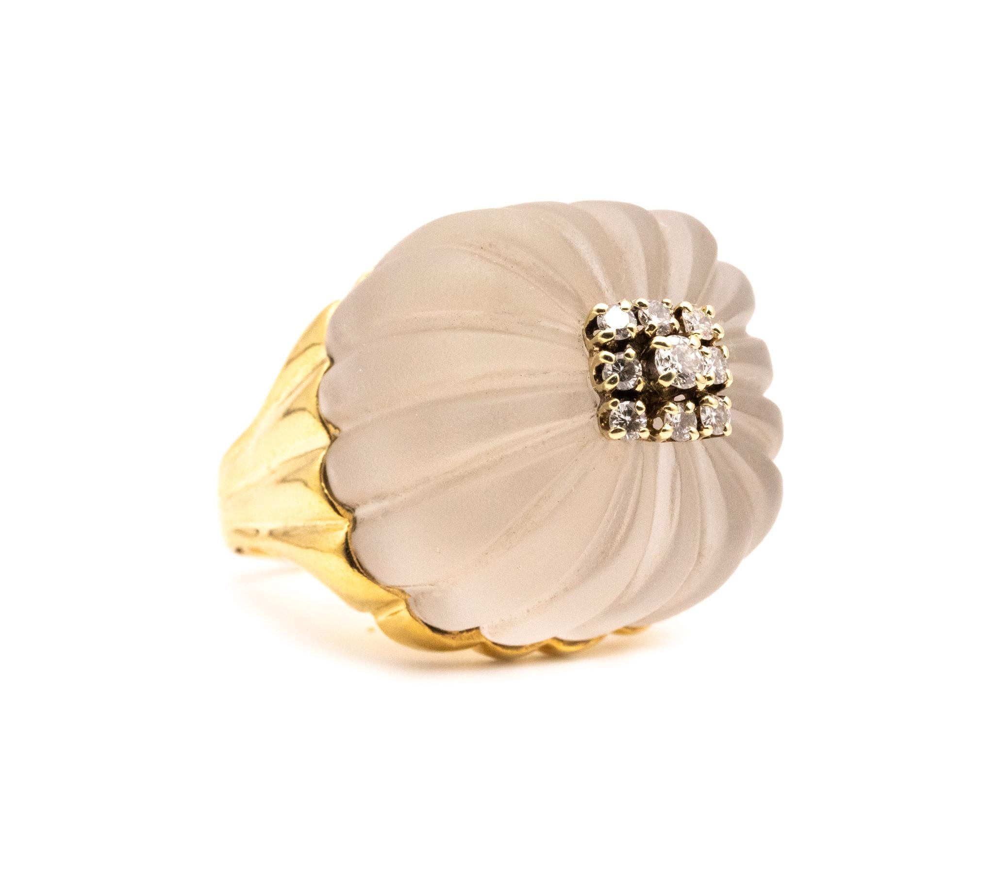 Chic and elegant cocktail ring from the mid century period. 

Flamboyant piece created around the 1960's with a reminiscence of the Hollywood golden era. Was crafted, with a fluted patterns in solid yellow gold of 18 karats.

Featuring on top, with