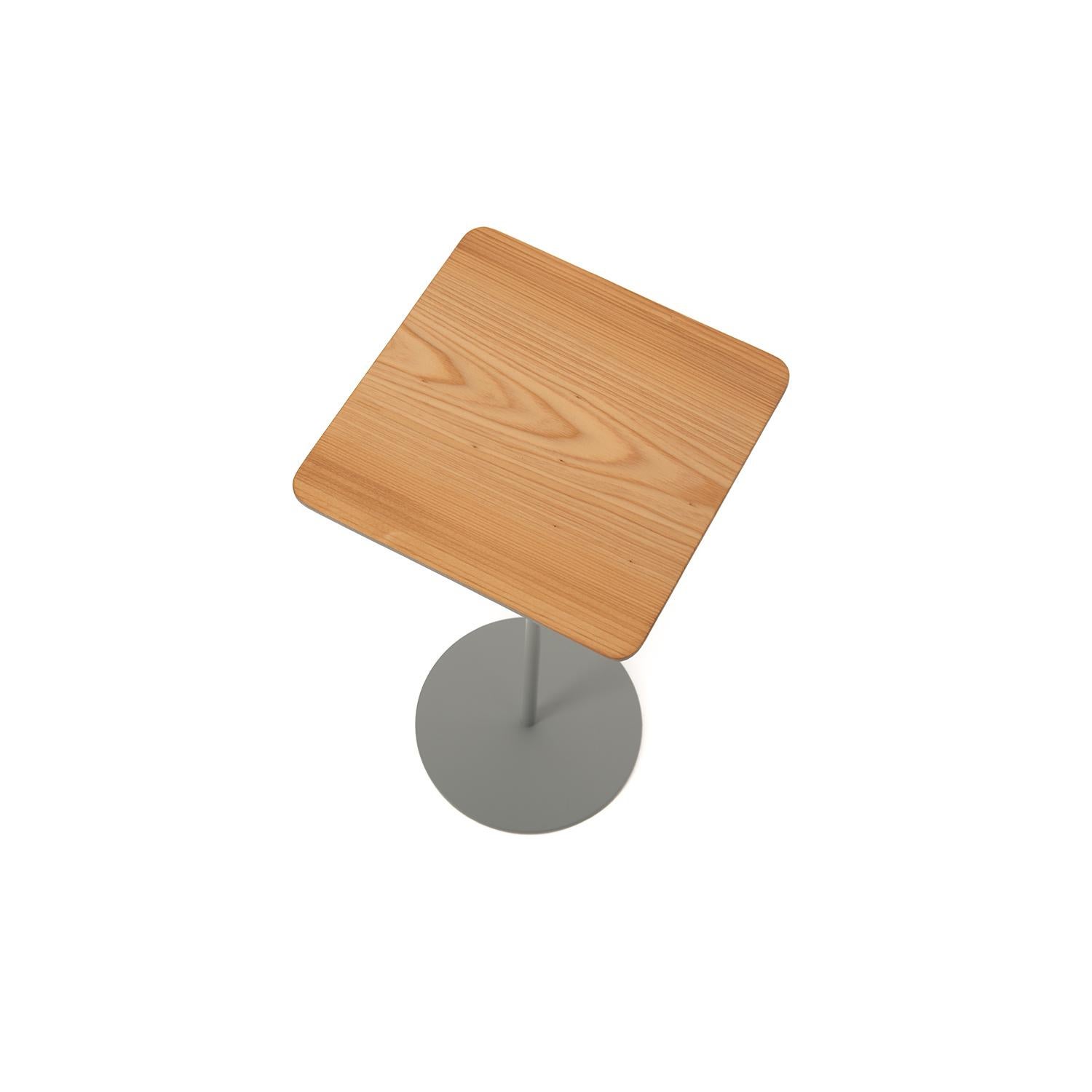This square top cypress table sits upon a slender, gray stem with a circular base.