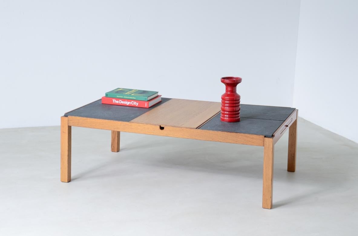 COD-2462
Low table with wooden and slate top, one compartment under the central wooden top and two side shelves.

Italian manufacture around 1960s.

125x75xh40
 
