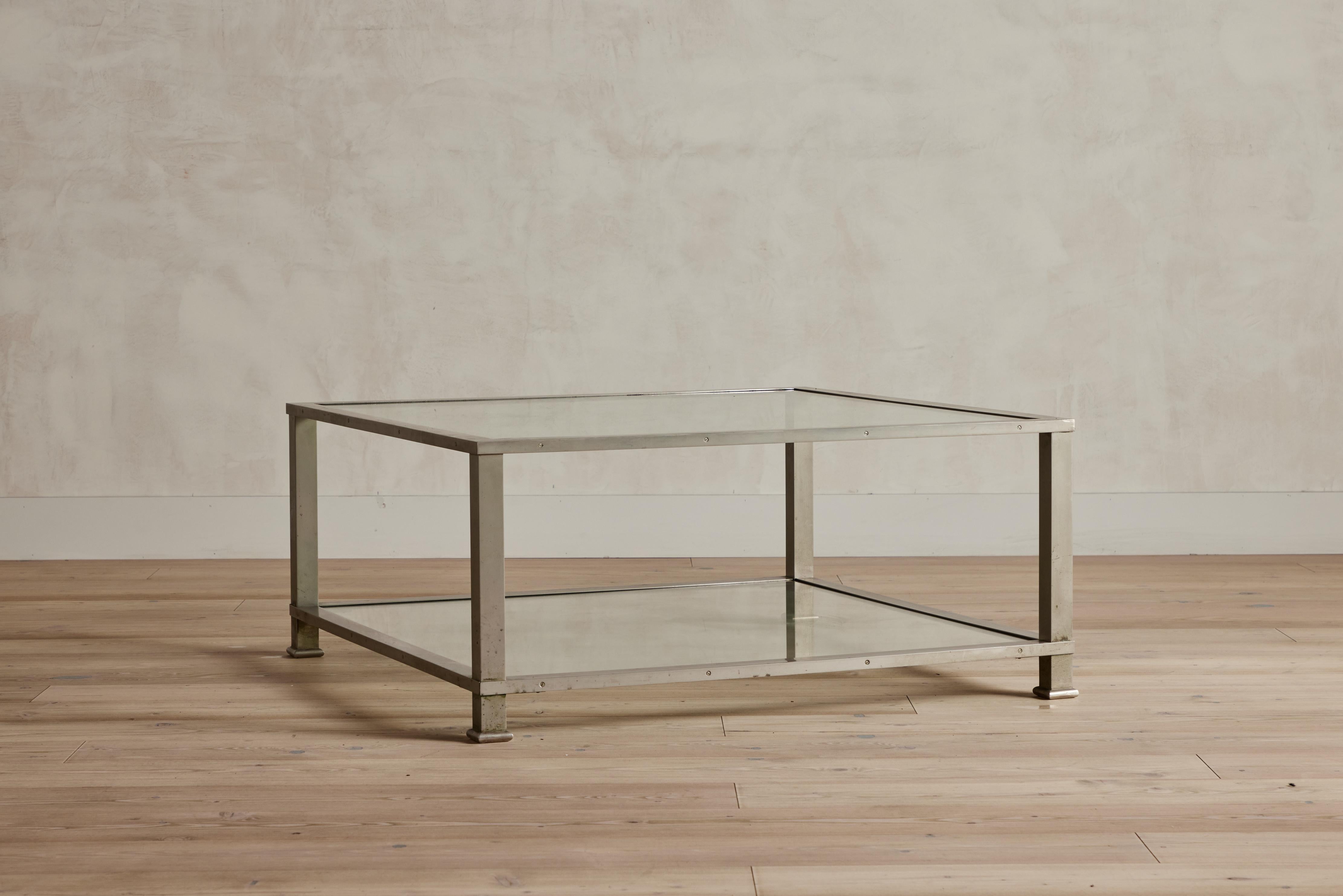 Modernist chrome and glass coffee table from France circa 1950. Wear is consistent with age and use.
