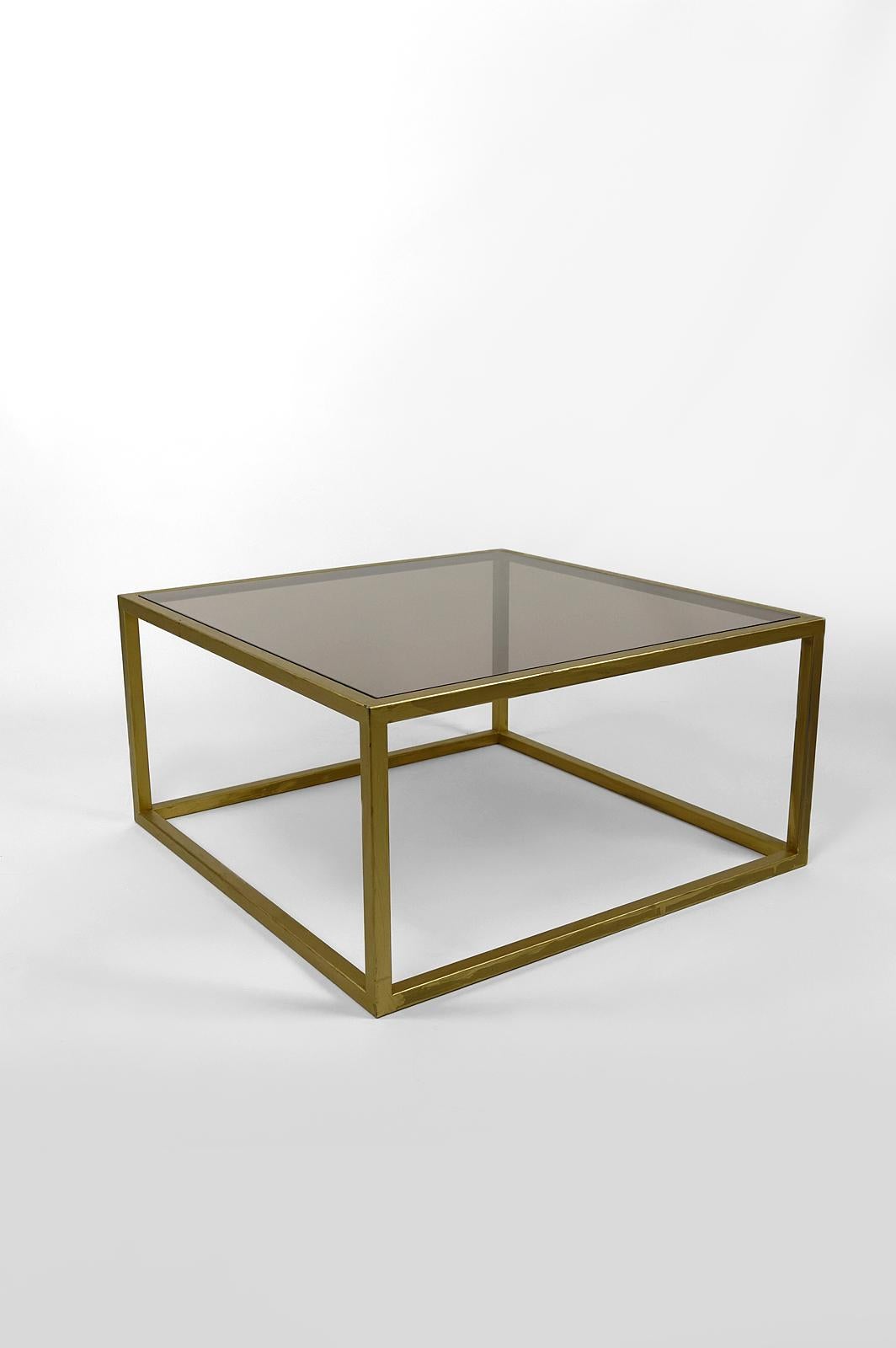 French Modernist coffee table in gilded metal and smoked glass, France, Circa 1970 For Sale