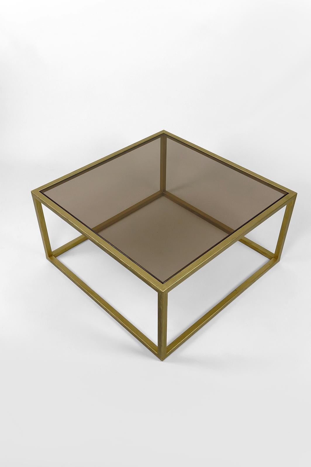 Gilt Modernist coffee table in gilded metal and smoked glass, France, Circa 1970 For Sale