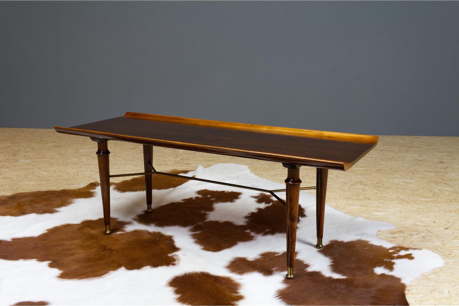 Slender mahogany coffee table from the Poly-Z serie, designed by Abraham Patijn (during the late 1950s) for Dutch manufacturer Zijlstra. Patijn was a Dutch architect and designer (1922-1985) and committed to bring modern design to a wider audience.