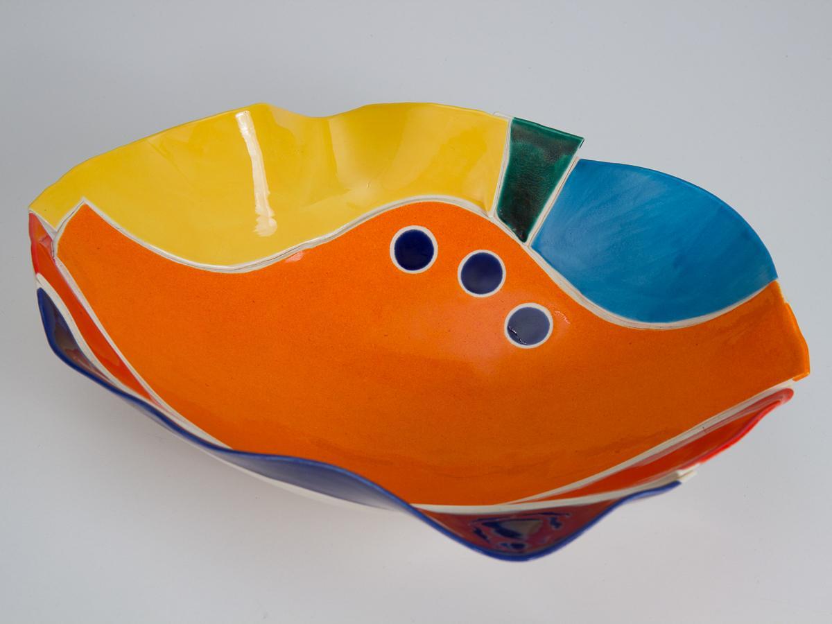 Impressive modernist studio pottery bowls, signed by Jill Peterson. Hand built with great skill from delicate porcelain, these large bowls feature an abstract decor in a bold and bright palette. The overall form seems to be collaged from these