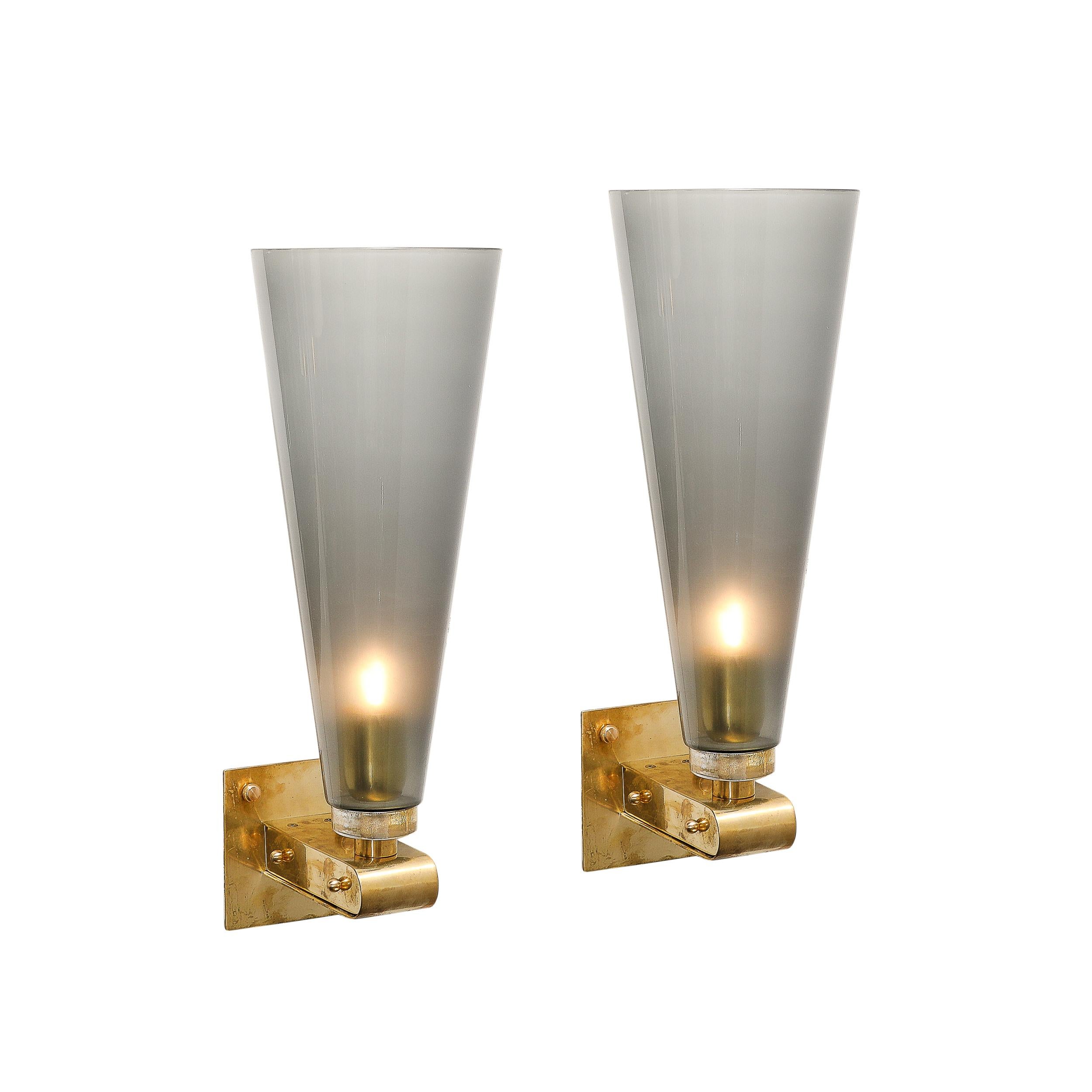 These beautifully composed and materially distinct Modernist Conical Hand-Blown Murano Glass Sconces in Smoked Graphite W/Brass Fittings originate from Italy during the 21st Century. Featuring vertically oriented conical shade formed in Hand-Blown