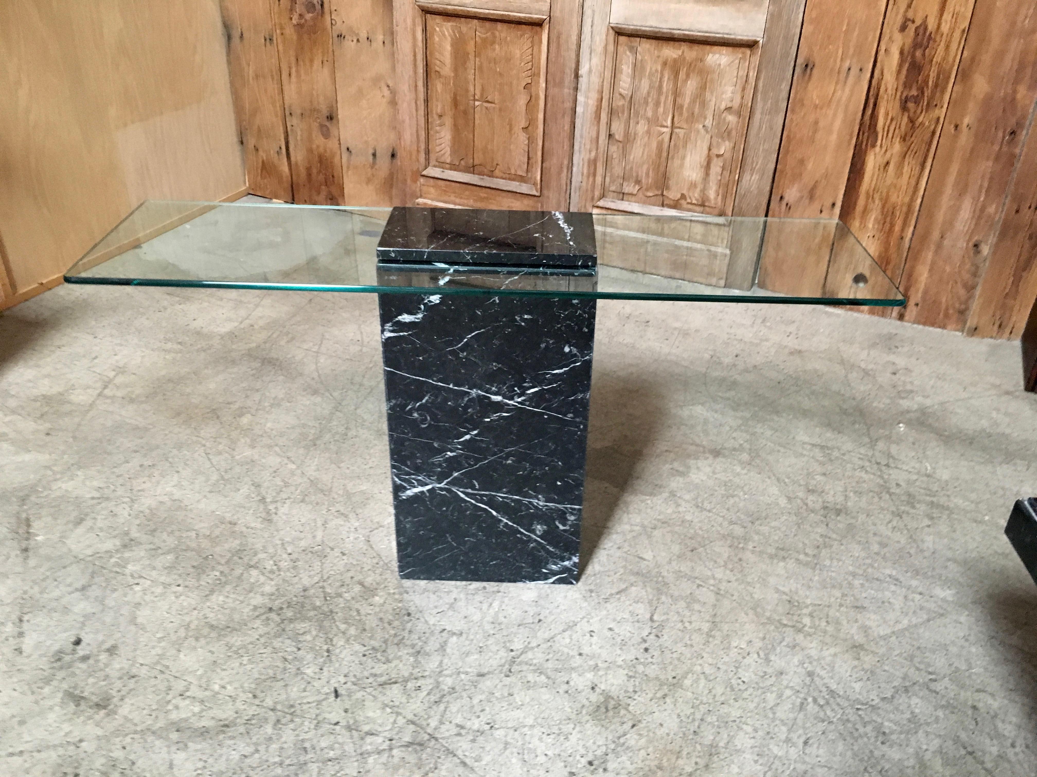 Italian black and white Sardegna marble with glass top.