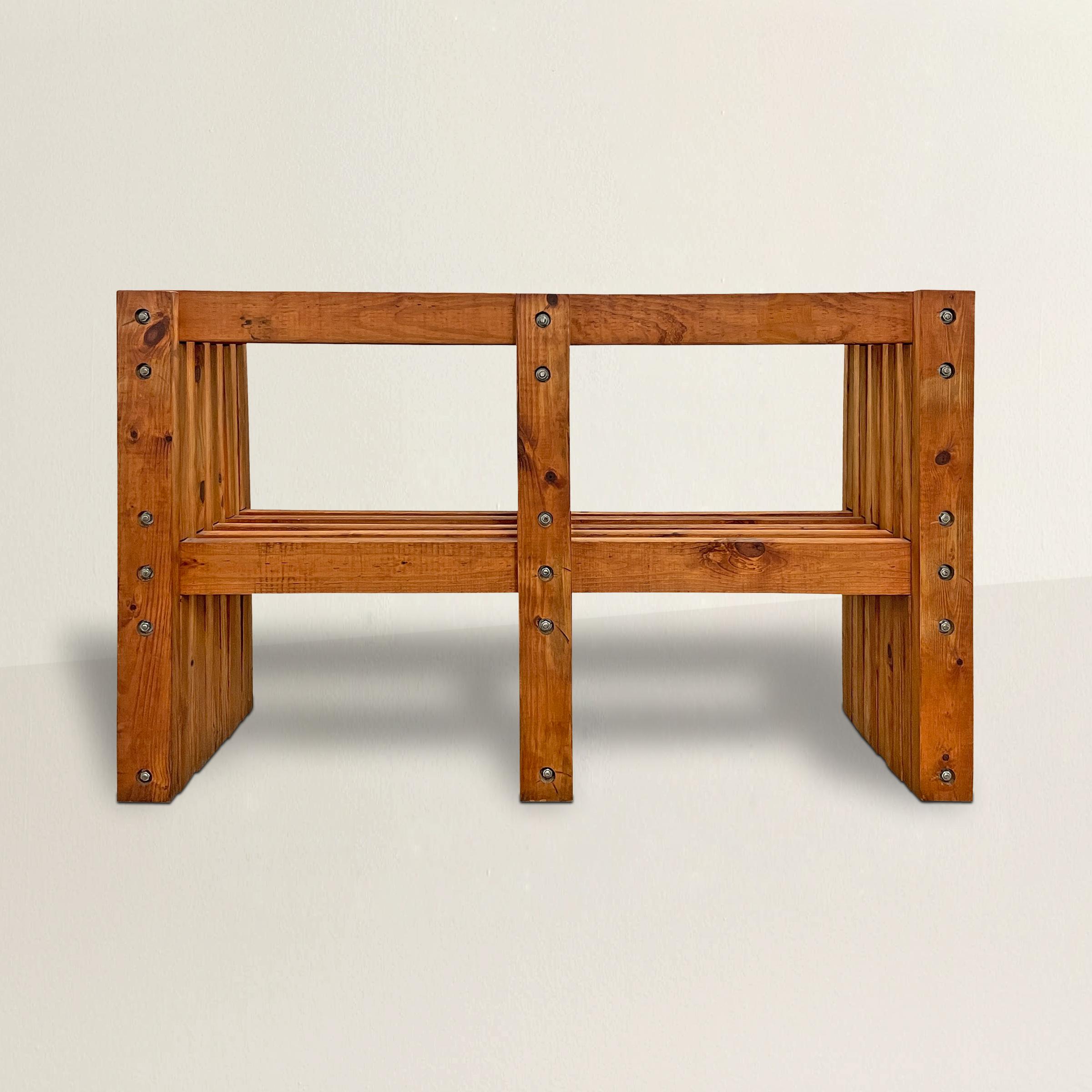 A chic American Modernist console table constructed from dozens of pine boards with a slatted top and through-tenon lower shelf, and all hello together with heavy bolts. An incredible console table in your entry, under a television, or used as a