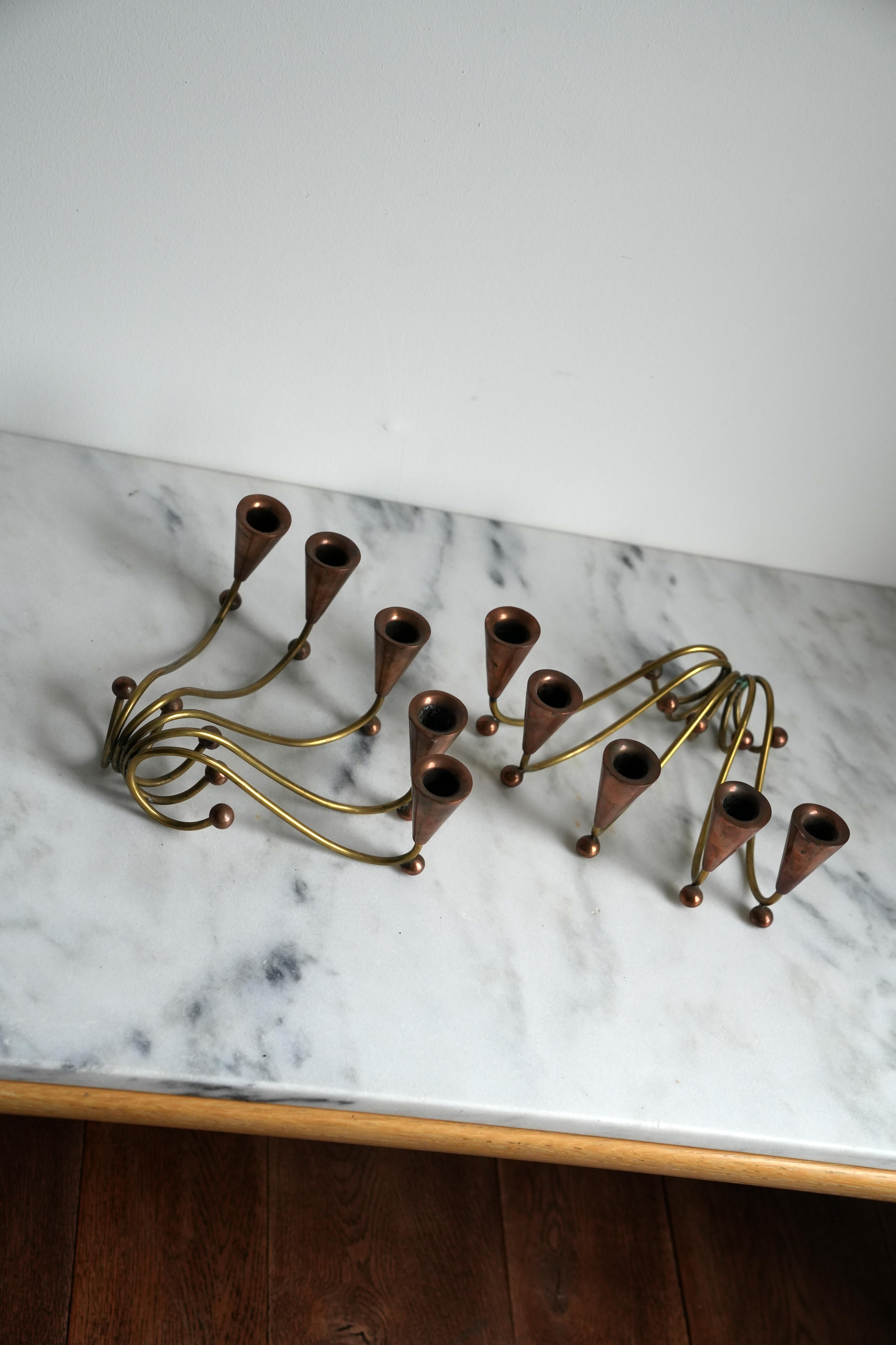 Modernist copper and brass candlesticks.
1970s Studio craft.