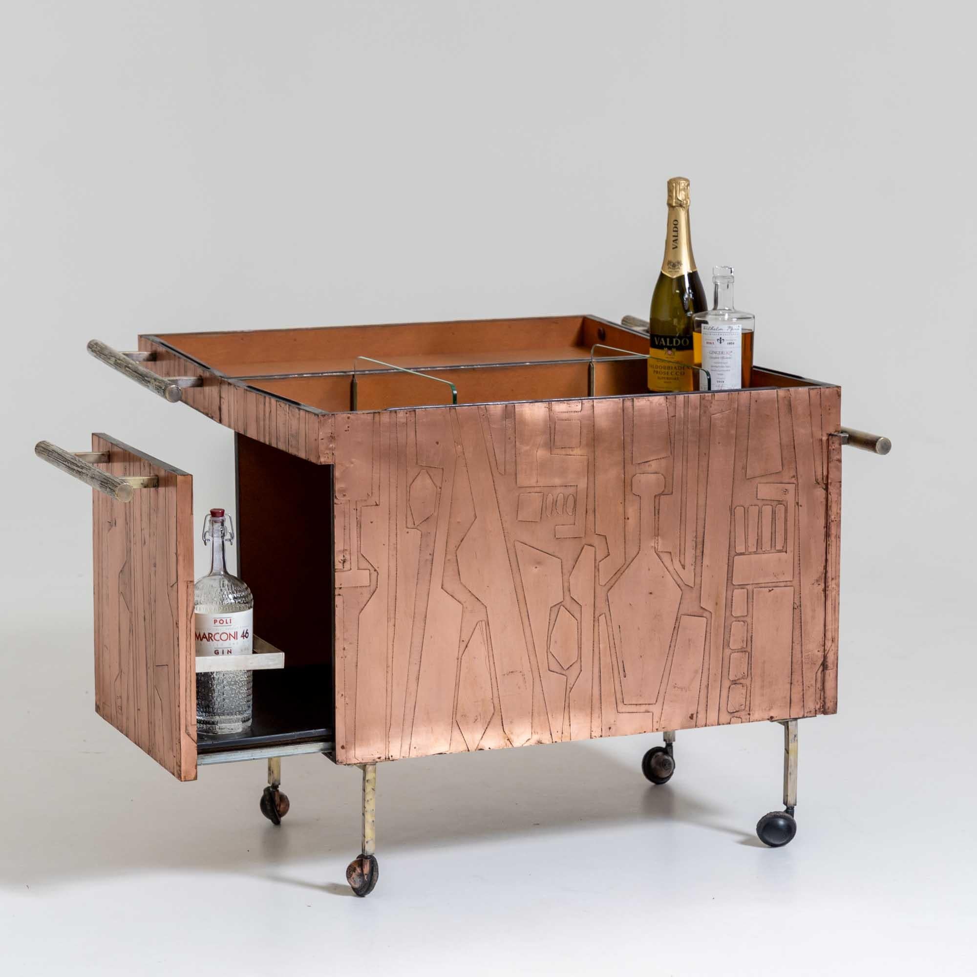 A Modernist Copper bar cart with abstract cocktail motif covering the exterior.
Featuring a flip-up top and two pull out sides for additional storage.