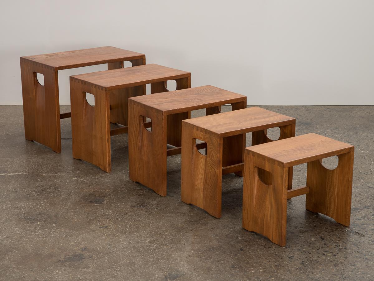 Set of five modernist tables or stools, with strong Japanese woodworking influence. Simple rectangular form with box joinery and carved handles. Clever design allows for endless uses, as side tables or even stacked to create a display. Tables nest