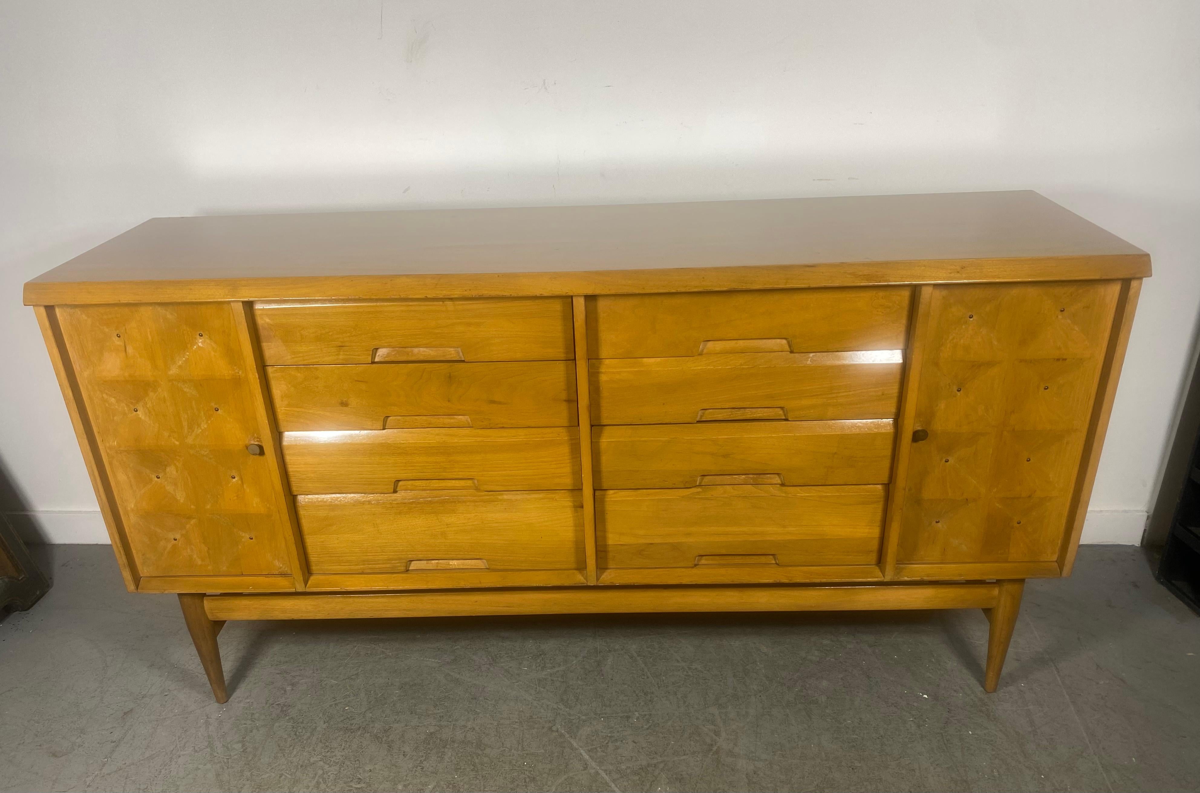 Modernist credenza /server, button tufted doors designed by Salvatore Bevelacqua, Classic design, amazing quality and construction. Featuring 8 dovetail drawers, left and right storage, retains original condition, finish, age appropriate wear, minor