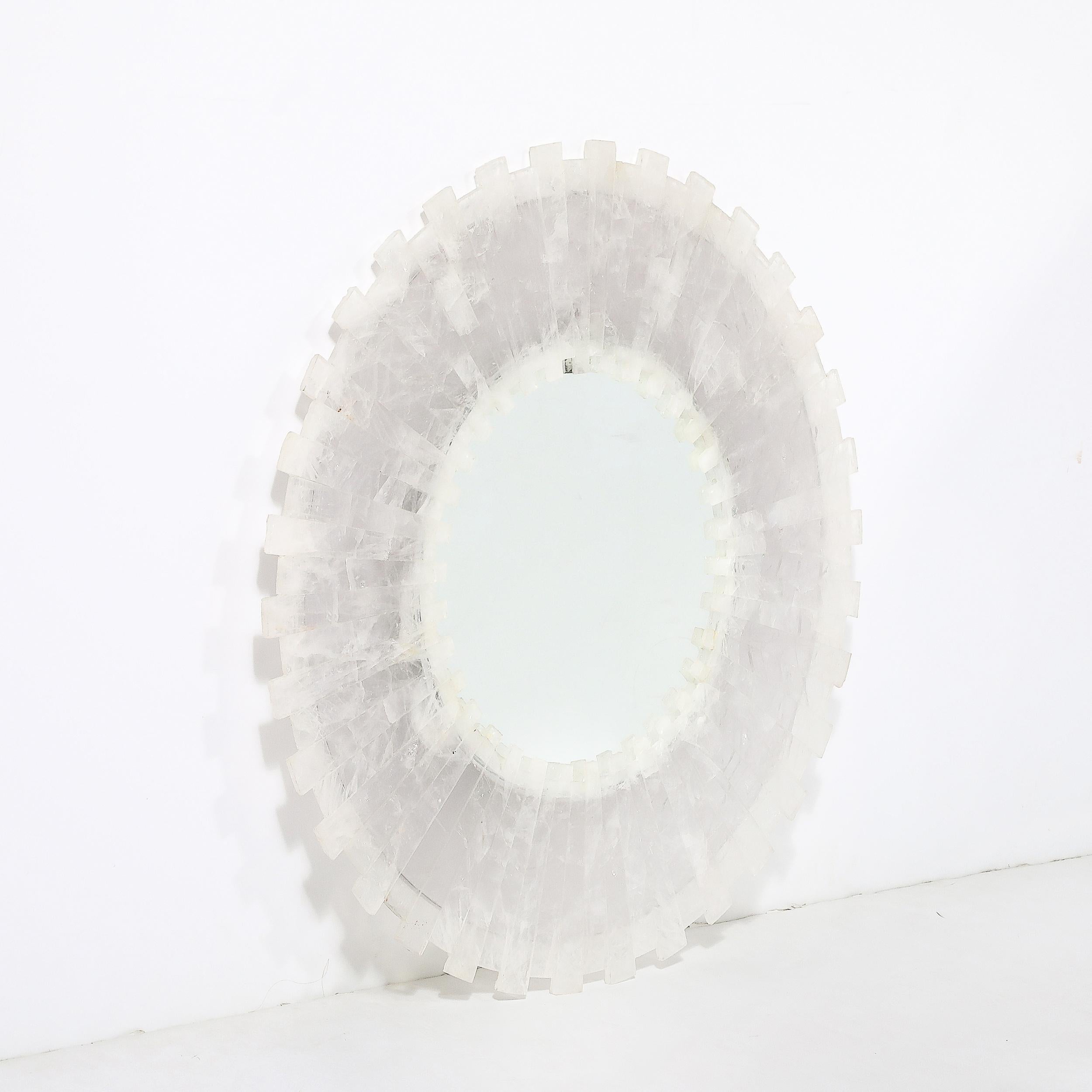 This elegant and highly sophisticated Modernist Custom Tessellated Starburst Rock Crystal Mirror by High Style Deco originates from the United States during the 21st Century. This stunning piece features a circular panel of mirror framed by