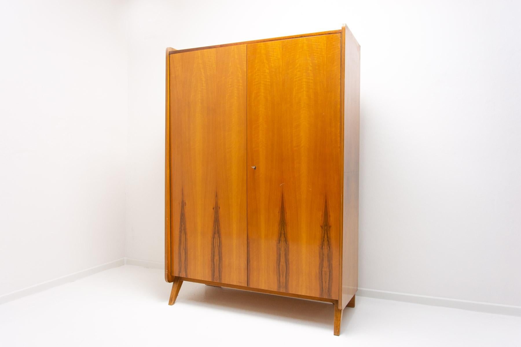 Vintage Czechoslovak modernist wardrobe designed by Frantisek Jirak for Tatra nabytok. Made in Czechoslovakia during the 1960s. It is made of beechwood and plywood. This item is in good vintage condition without visible damage, showing slight signs