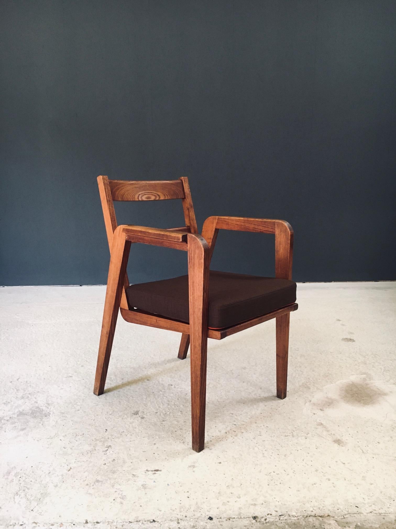 Vintage Modernist Design Armchair. Made in France, 1940's / 50's period. Beautiful open design on this side arm chair. Solid oak constructed chair with newly made cushion in brown and orange woolen fabric. The chair comes in good condition for it's