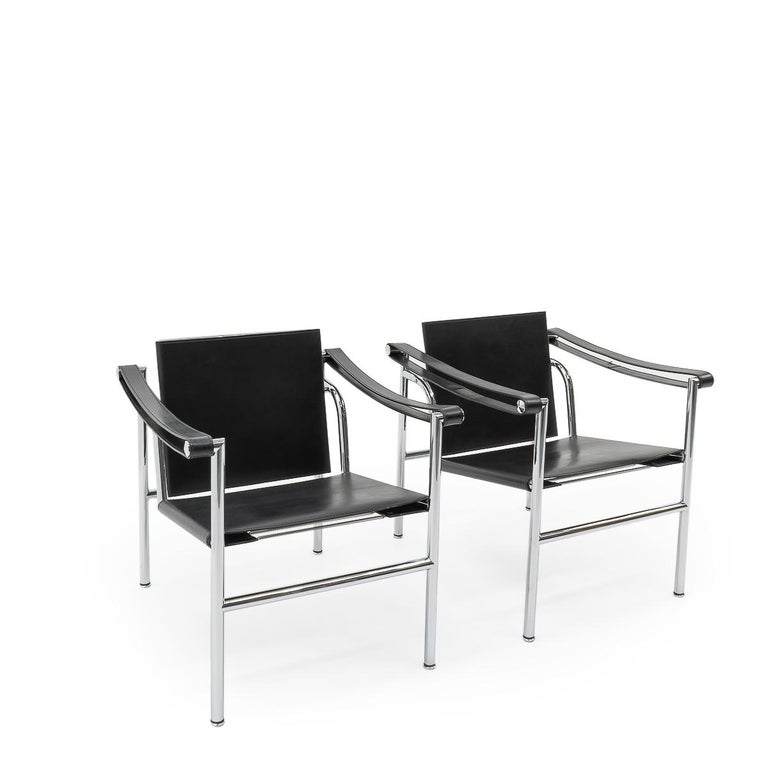 A matching pair of LC1 armchairs designed by Le Corbusier, Pierre Jeanneret and Charlotte Perriand during the late 1920 and built up using chromed metal tubes and leather.

Our set dates from the 1980s, and still remains in very good condition