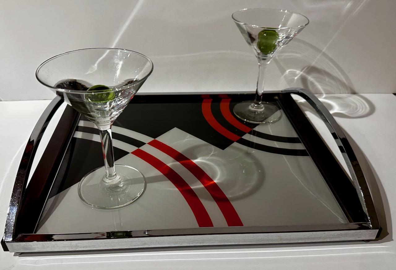 Modernist Donald Deskey Cocktail Tray Art Deco for Barware. This dynamic reverse-painted glass tray is extremely rare and a great addition to your Art Deco collection, in both artistic design and cocktail culture.

Constructed with a chrome tray and
