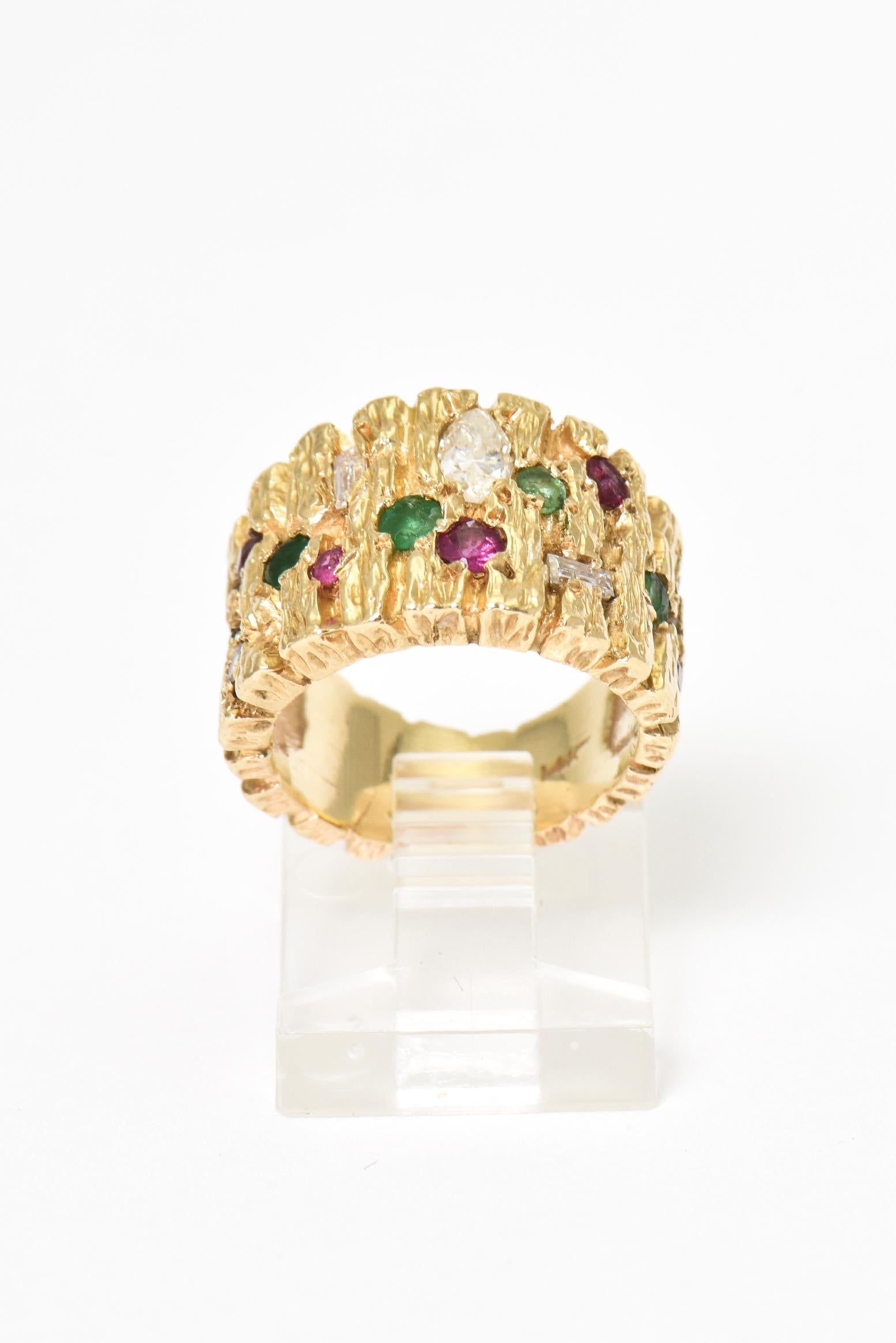 Modernist brutalist ring with inset diamond, rubies and emeralds in a wide 14k yellow gold mounting.

Size 4