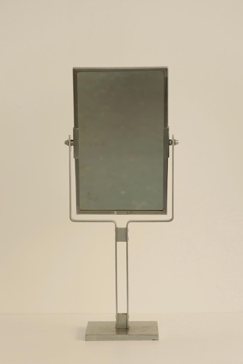 A sleek and elegant 1930s Dutch modernist double-sided mirror. Crafted with a chrome frame, this versatile piece reflects the streamlined aesthetics of the modernist movement.
