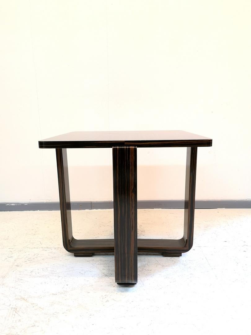 This ebony Macassar table features a hand-polished french varnish in a high gloss finish.