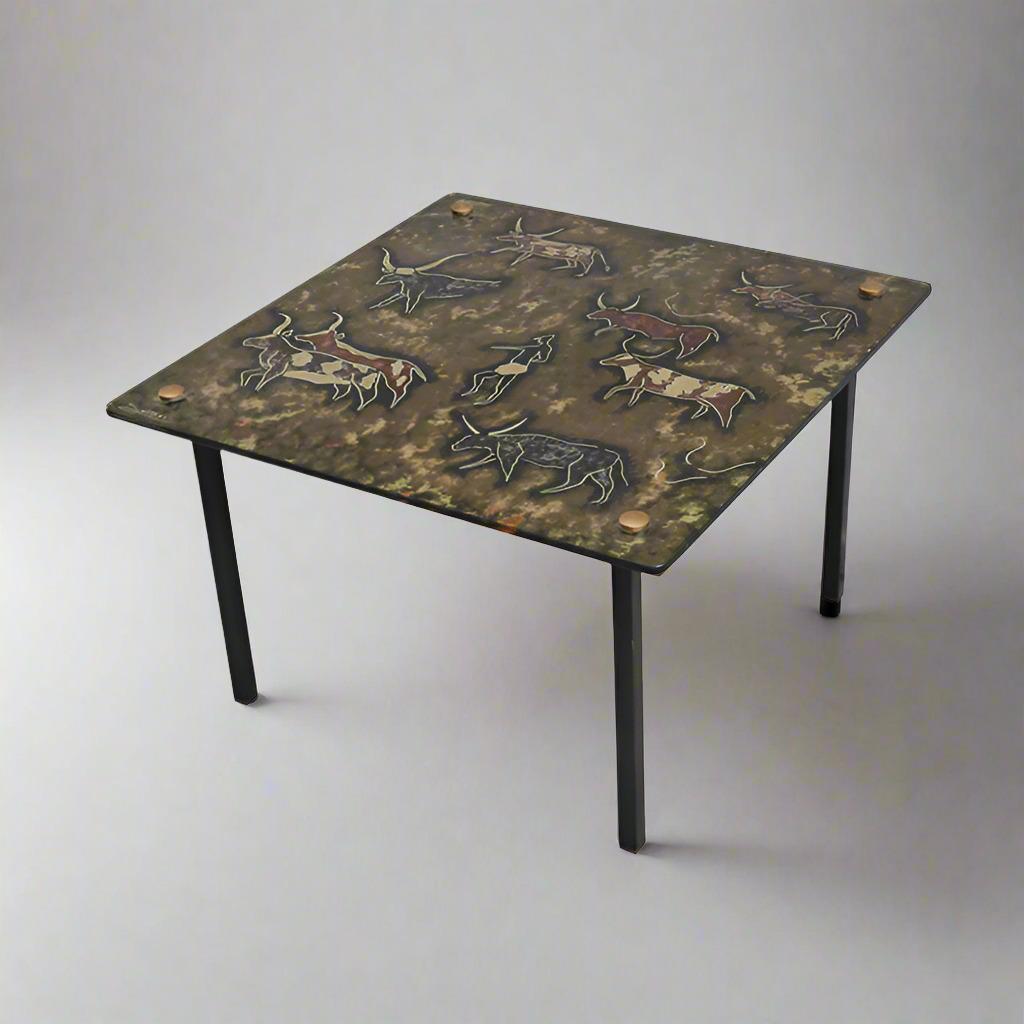 A Modernist eglomisé glass top side table.
Painted glass top with cave painting motif ,
resting on a black iron frame.
Signed: Sasco 61.
