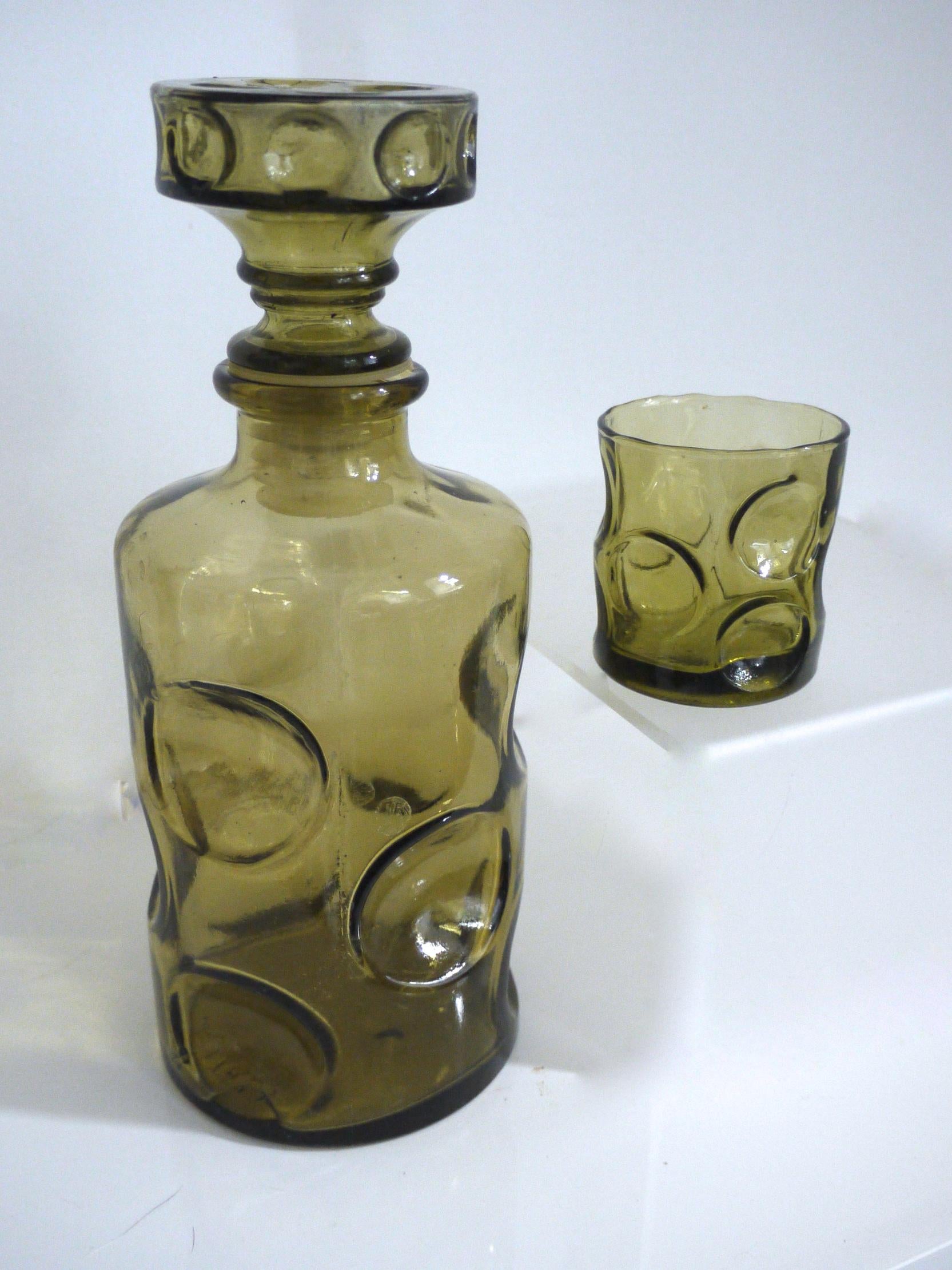 Modernist Empoli 'Dimpled' vase decanter and glass for one- 1950s pressed glass decanter 

Measures: Height 24 cms, diameter 10 cms

Tumbler
Height 6 cms, diameter 6 cms.