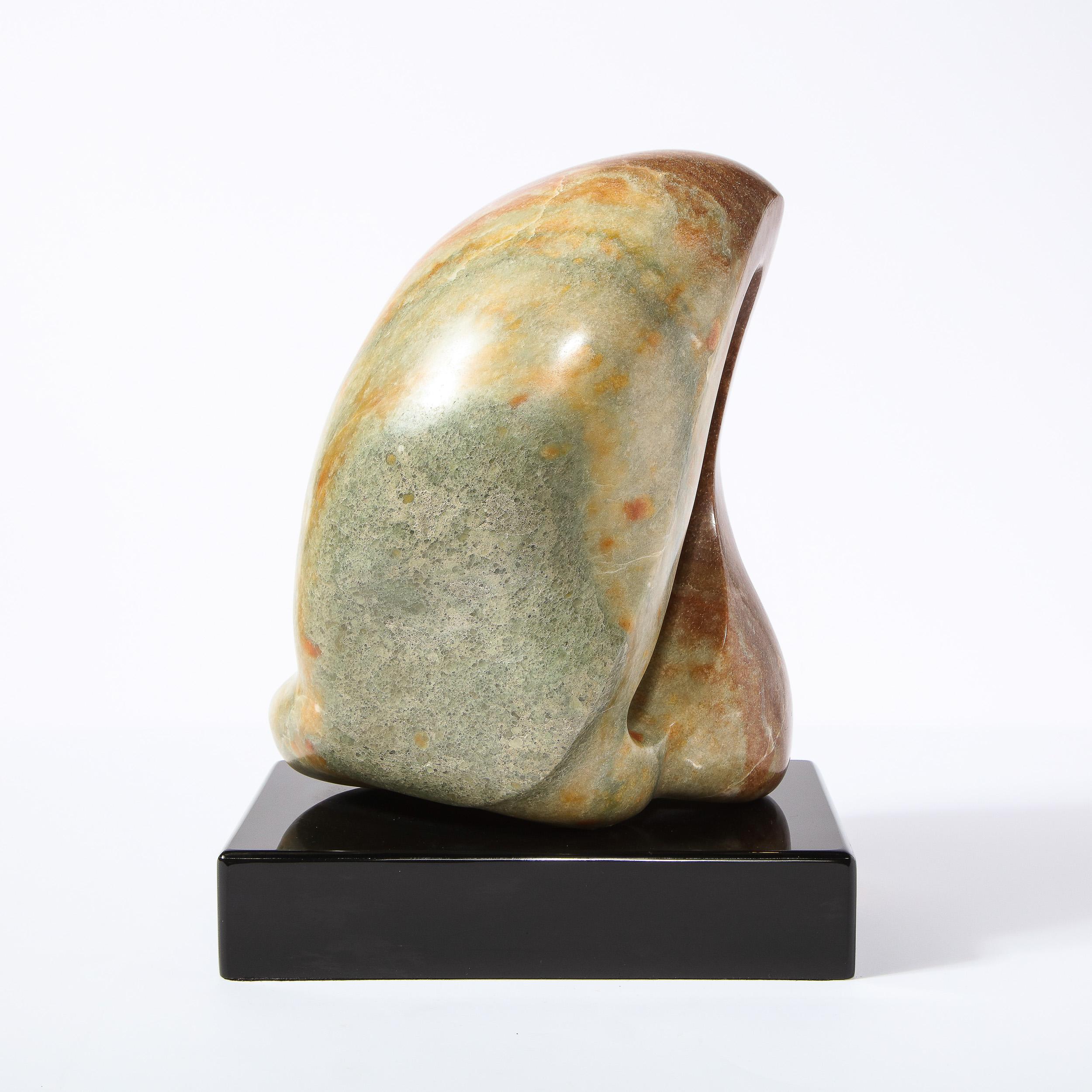 This sophisticated exotic green marble modernist sculpture, entitled 