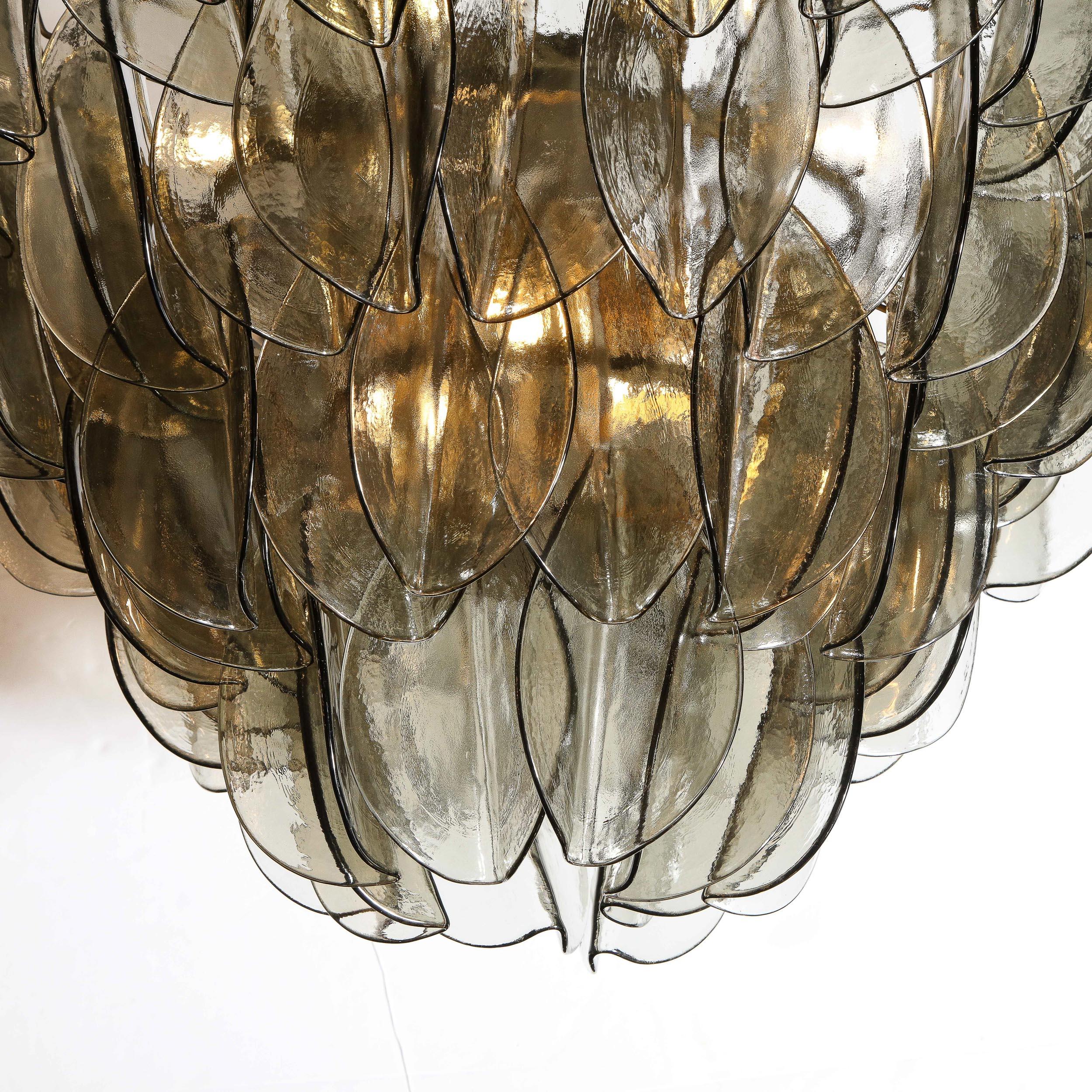 This refined and sophisticated chandelier was realized in Murano, Italy- the islands off the coast of Venice renowned for centuries for their superlative quality glass production. It offers an abundance of handblown Murano glass shades in a Topaz