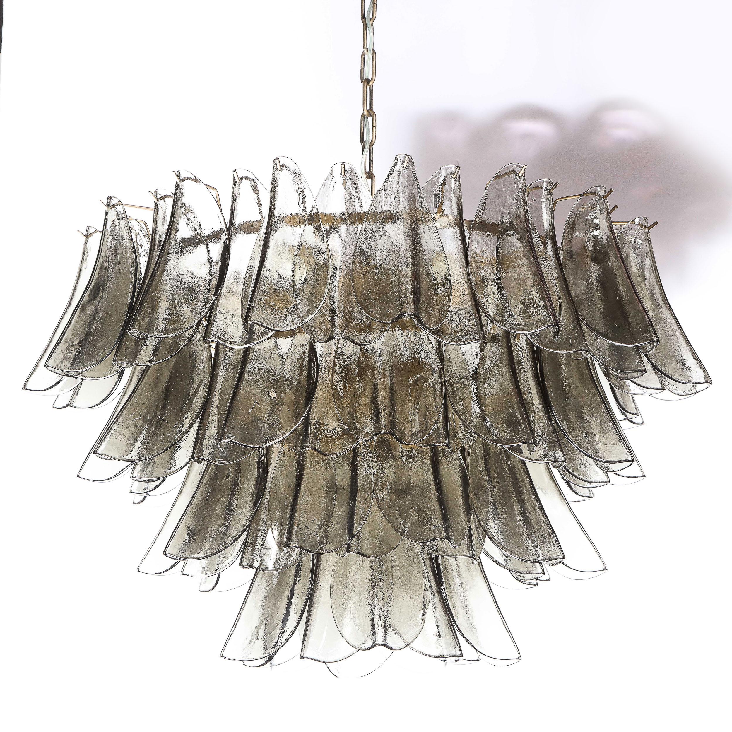 This refined and sophisticated chandelier was realized in Murano, Italy- the islands off the coast of Venice renowned for centuries for their superlative quality glass production. It offers an abundance of handblown Murano glass shades in a Topaz