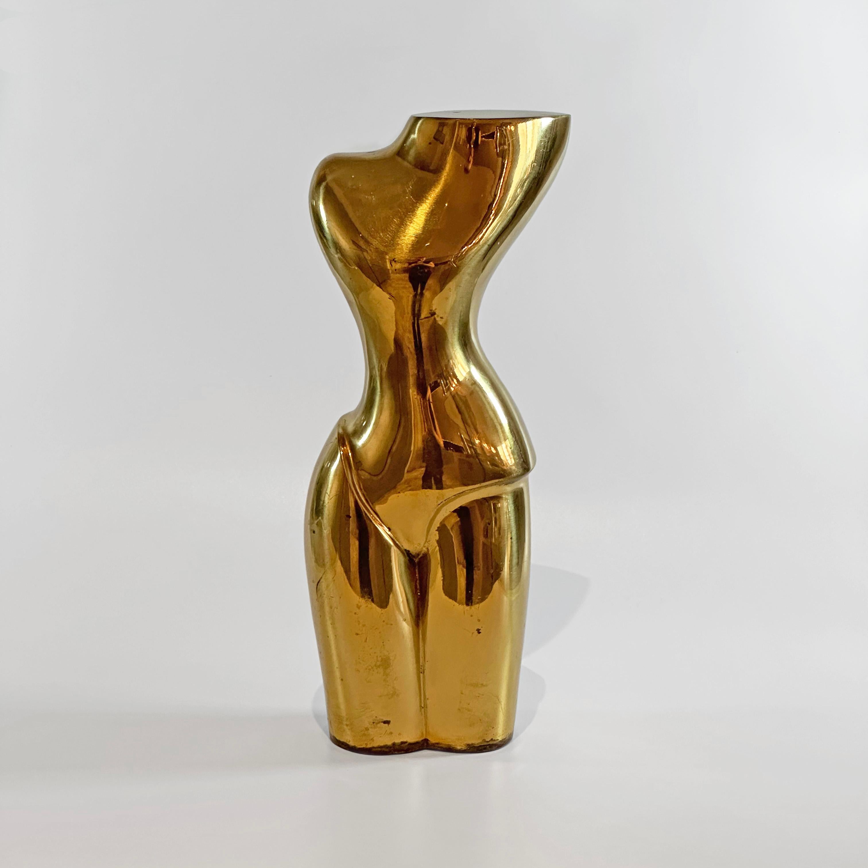 This exquisite Almazan brass figure is a testament to the refined aesthetics of 1970s Spain, embodying the era's modernist verve with a nod to the stylized forms reminiscent of Tamara de Lempicka's work. The figure's silhouette flows with soft,