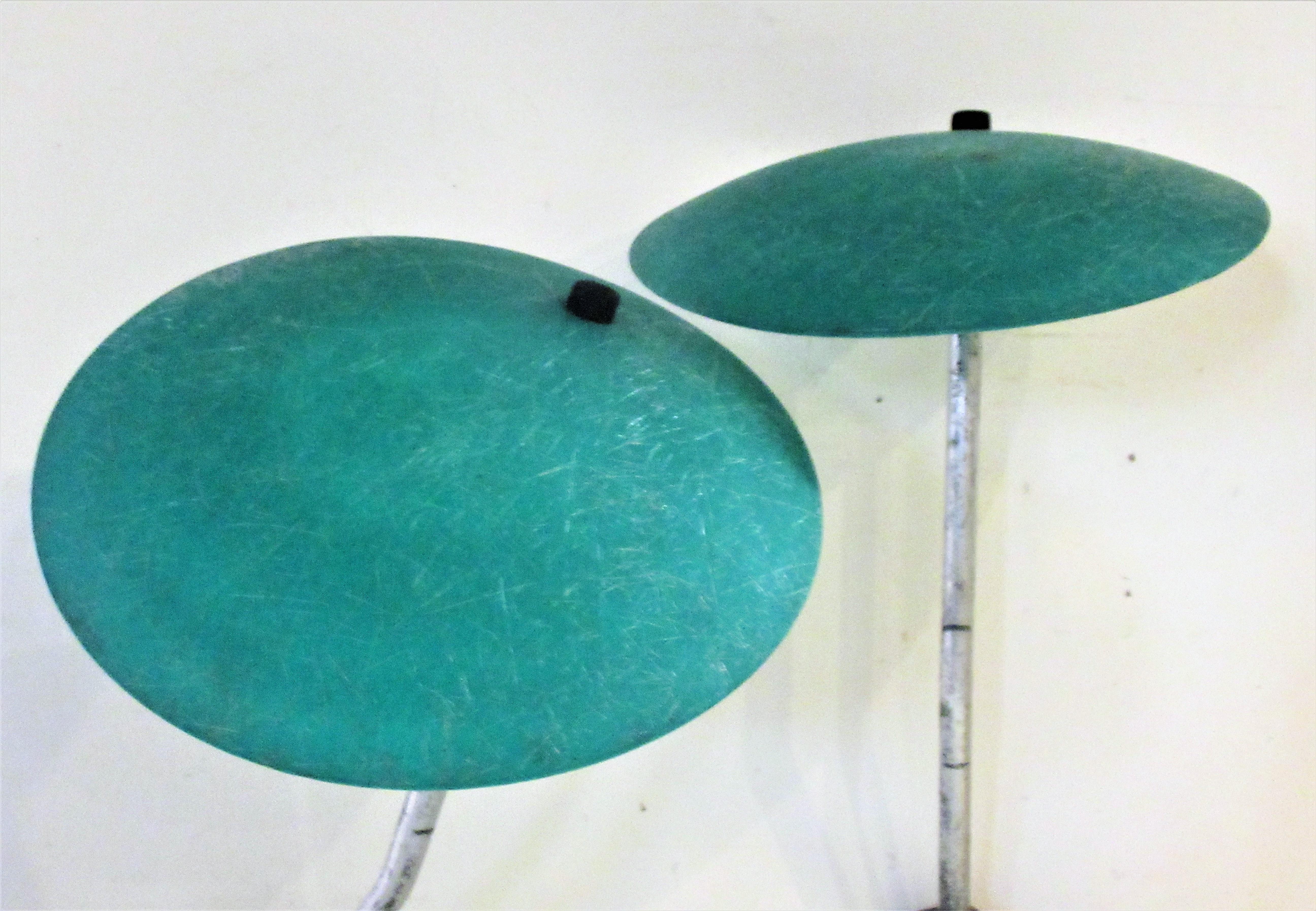 A pair of green fiberglass saucer shade portable electric outdoor lawn lamps mounted on staked tubular aluminum poles. The electric boxes at bottom with wiring and plugs of Industrial quality. The sockets are porcelain. Great looking sculptural form