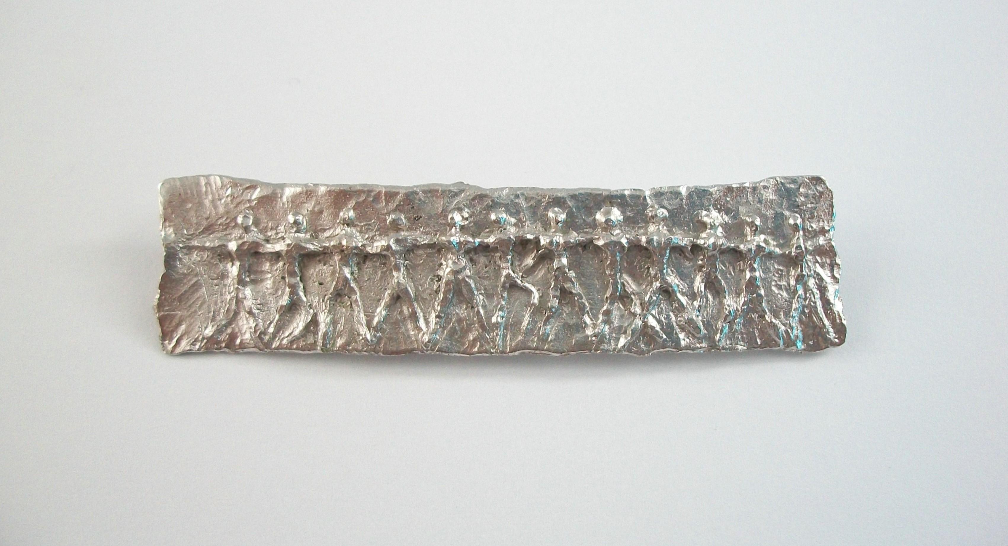 Modernist figurative 800 silver bar brooch - featuring a cast figure in motion - hand made - original hinge, pin and catch to the back - S.P. hallmark and 800 stamped on the pin (unknown/unidentified artist/maker) - Germany (likely) - mid 20th