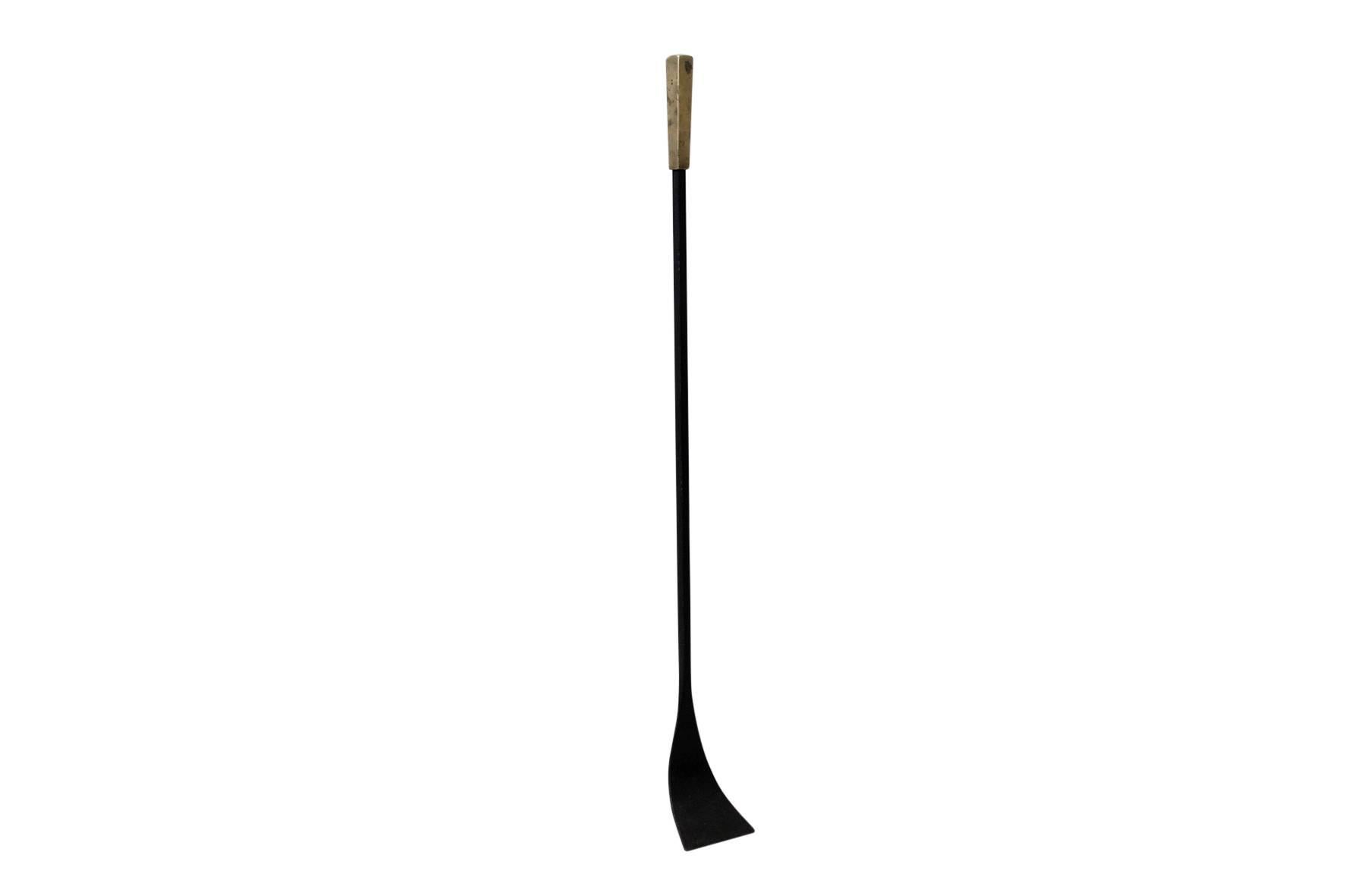 Large modernist iron and brass fire tool or shovel. Simple, elegant, and useful form. Attributed to Georg Masselman.