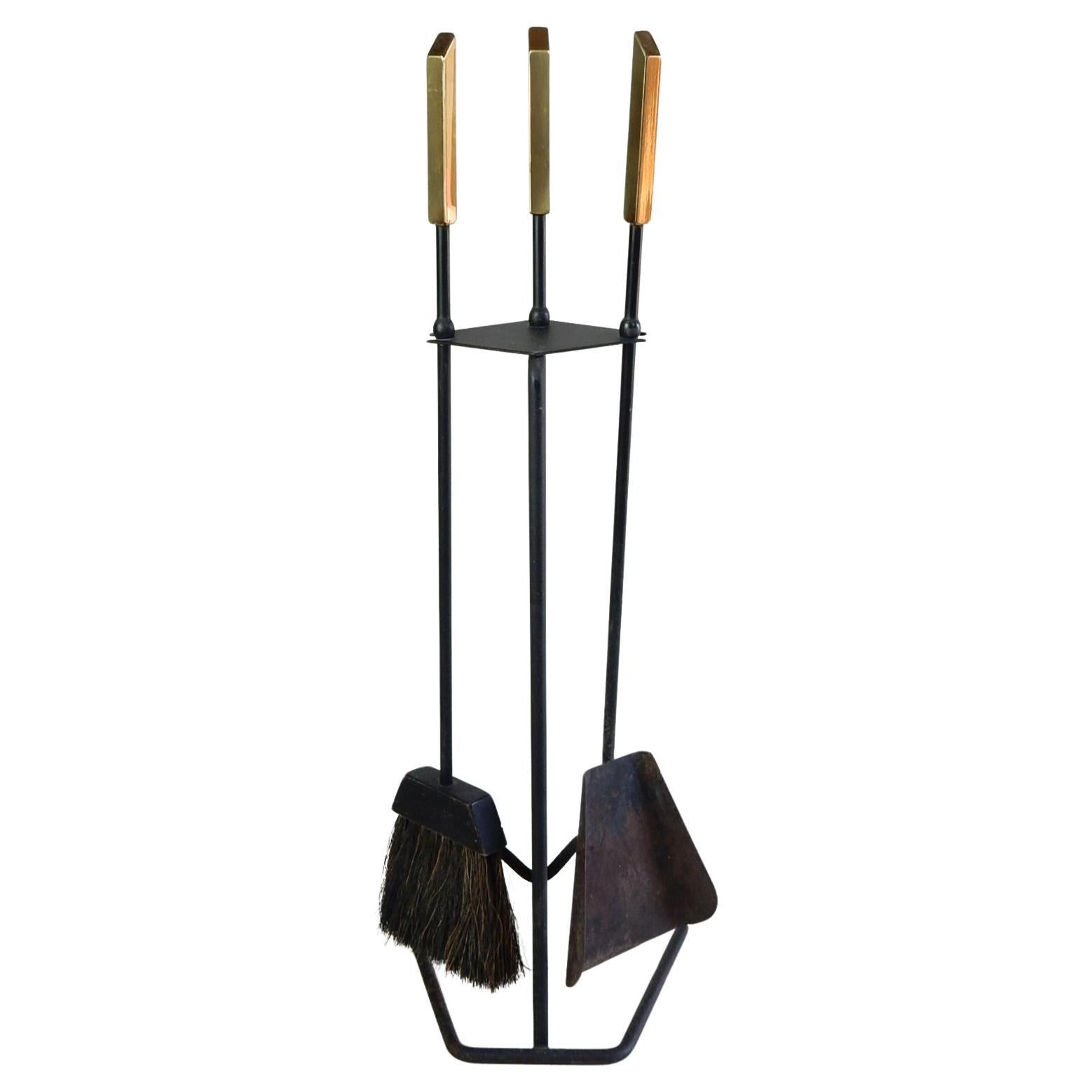 Blackened iron and brass handle 3 pc. fireplace tool set from the 1960's.
Well crafted and in amazing original condition. True horsehair broom.