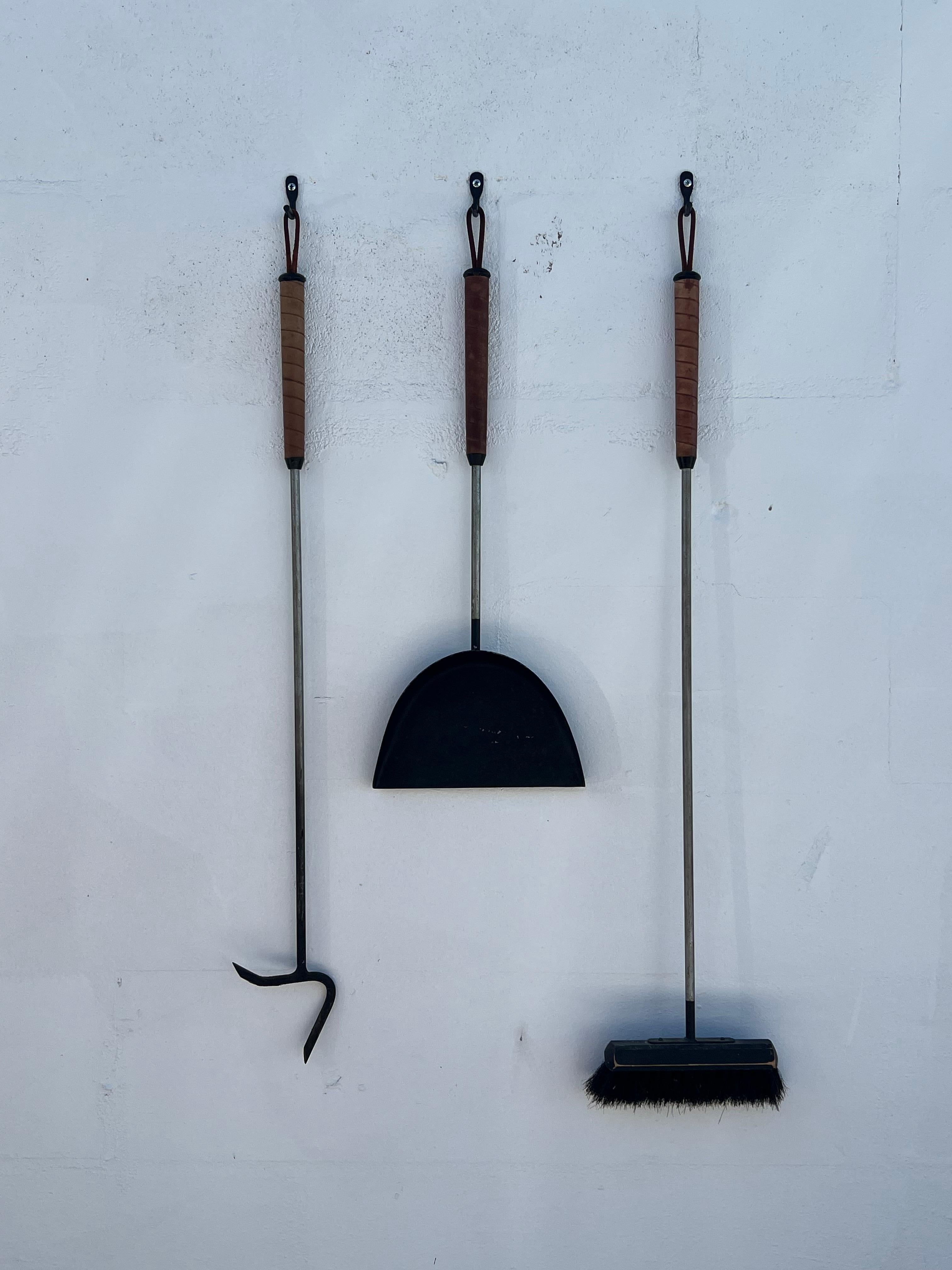 A modernist set of firetools. Leather wrapped handles, ca' 1950's. Beautifully made, nice patina.
