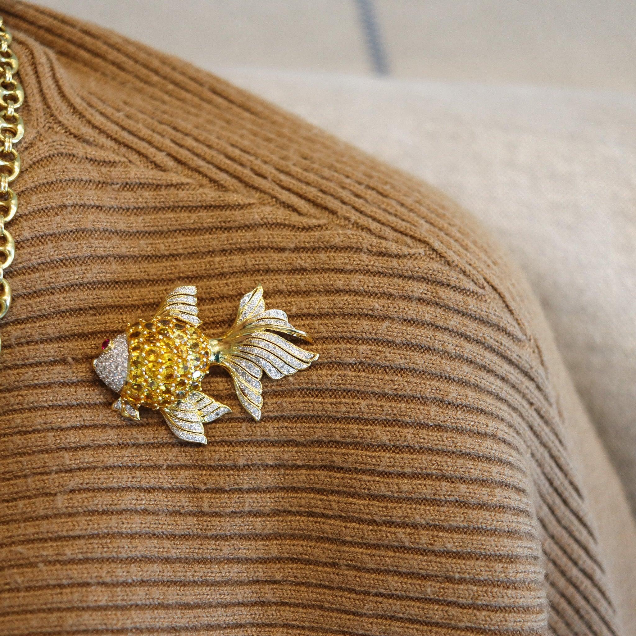 An Italian whimsical fish brooch.

This is a beautiful colorful brooch of a betta fish created in Italy with exceptional craftsmanship. The brooch has been crafted with thorough details and substantial weight in solid rich yellow gold of 18 karats