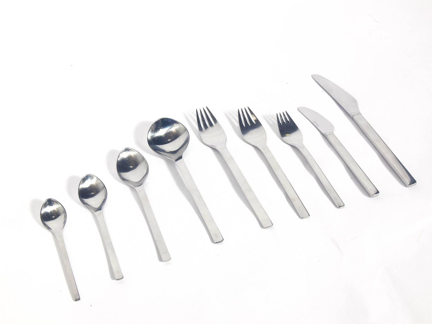 Modernist flatware set, designed by Magnus Stephensen for Georg Jensen, Denmark, circa 1960s. This pattern is called Tanaquil or Tuja. It is a piece set for ten people, 112 pieces total. It is constructed of low maintenance stainless steel and is