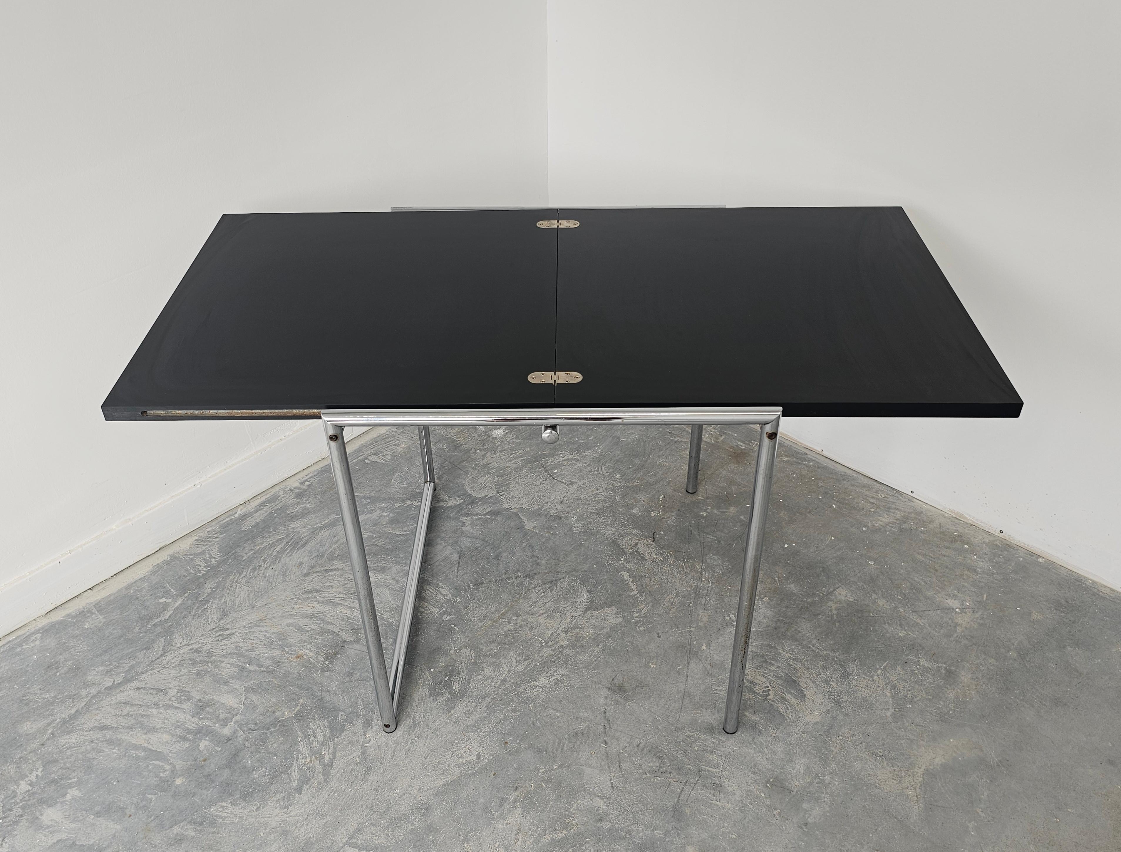 In this listing you will find a Modernist Flip Top Table 