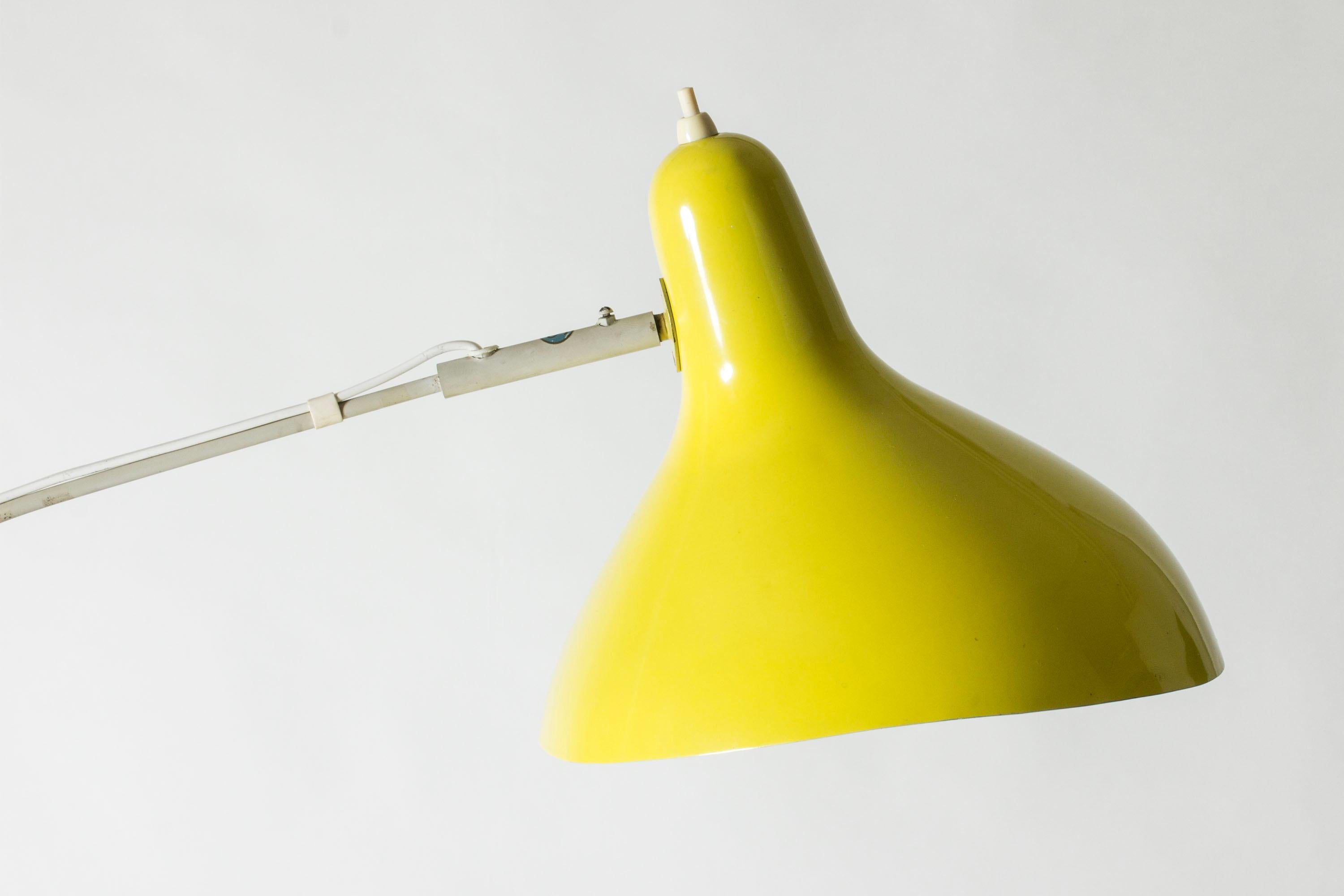 Very cool floor lamp by Bernard Schottlander, model called “Mantis”. Slender design with a both functional and decorative mechanism for adjusting the angle. Shade in original bright yellow lacquer, the rest of the lamp is lacquered pale grey.

Rare