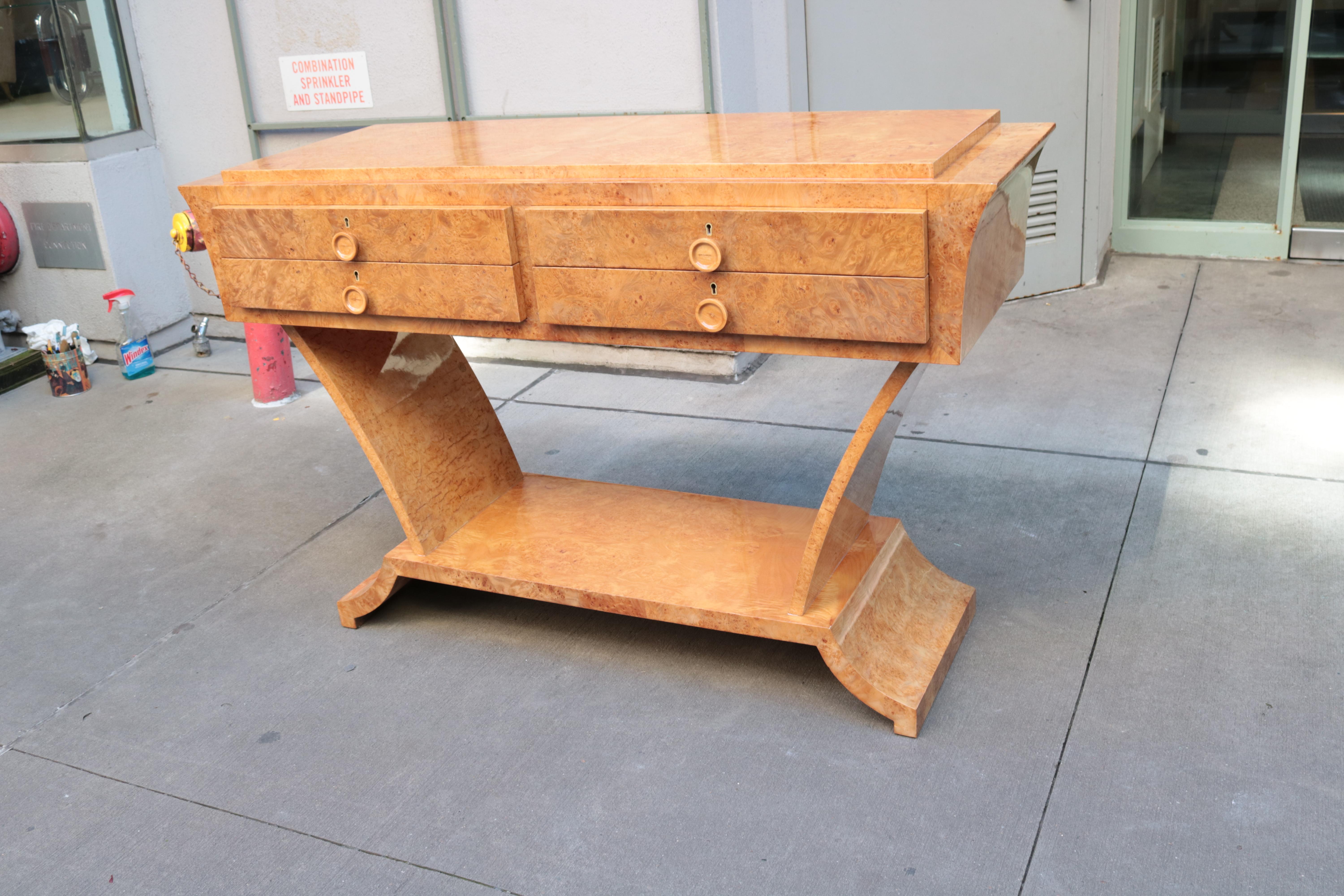 A Modernist four drawer console on a raised base. 
Birdeye Maple.