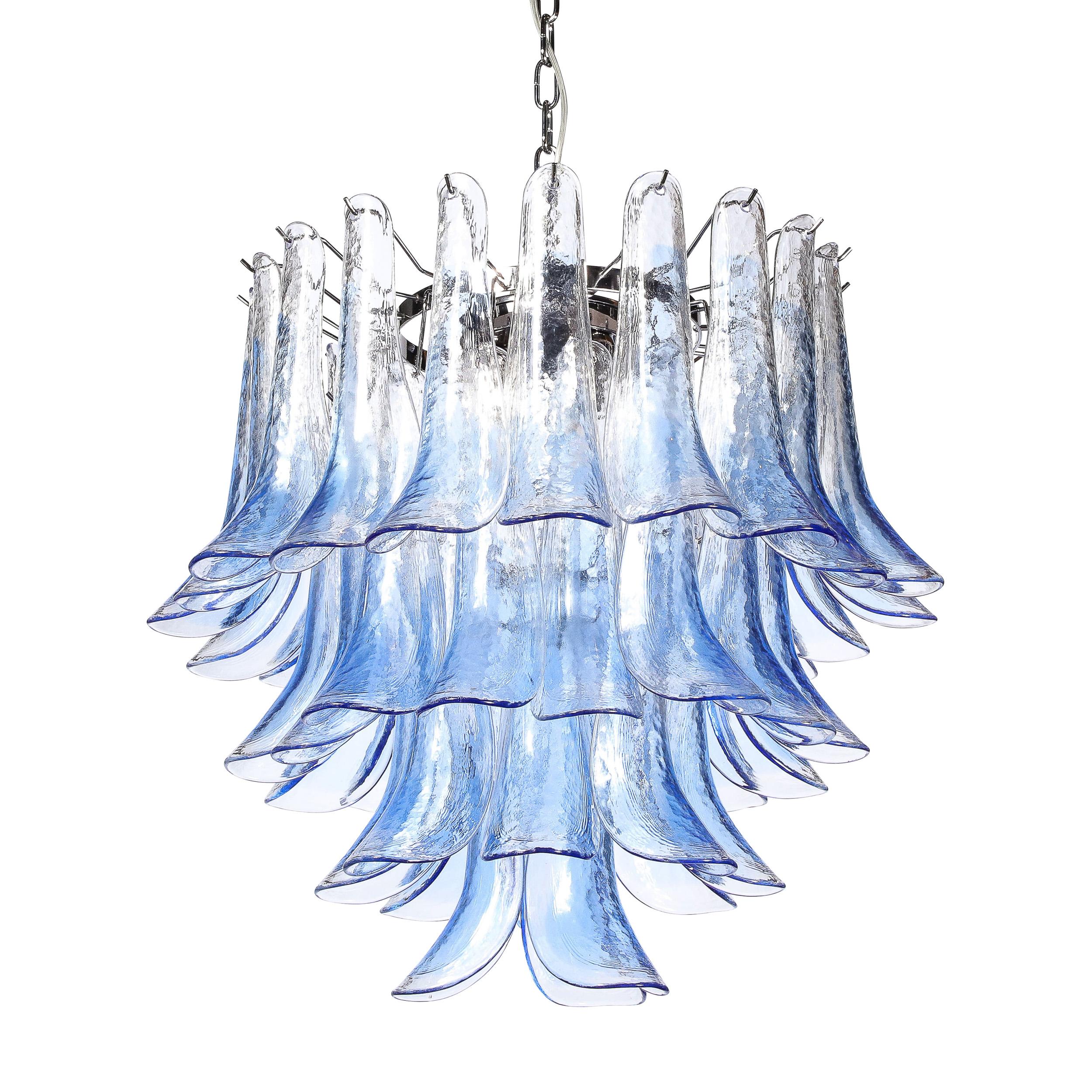 This lovely Modernist Hand-Blown Murano Glass Four-Tier Feather Chandelier in Cornflower Blue Originates from Italy during the Latter half of the 20th Century. With a chrome frame and fittings and rendered in lovely partially translucent  blue