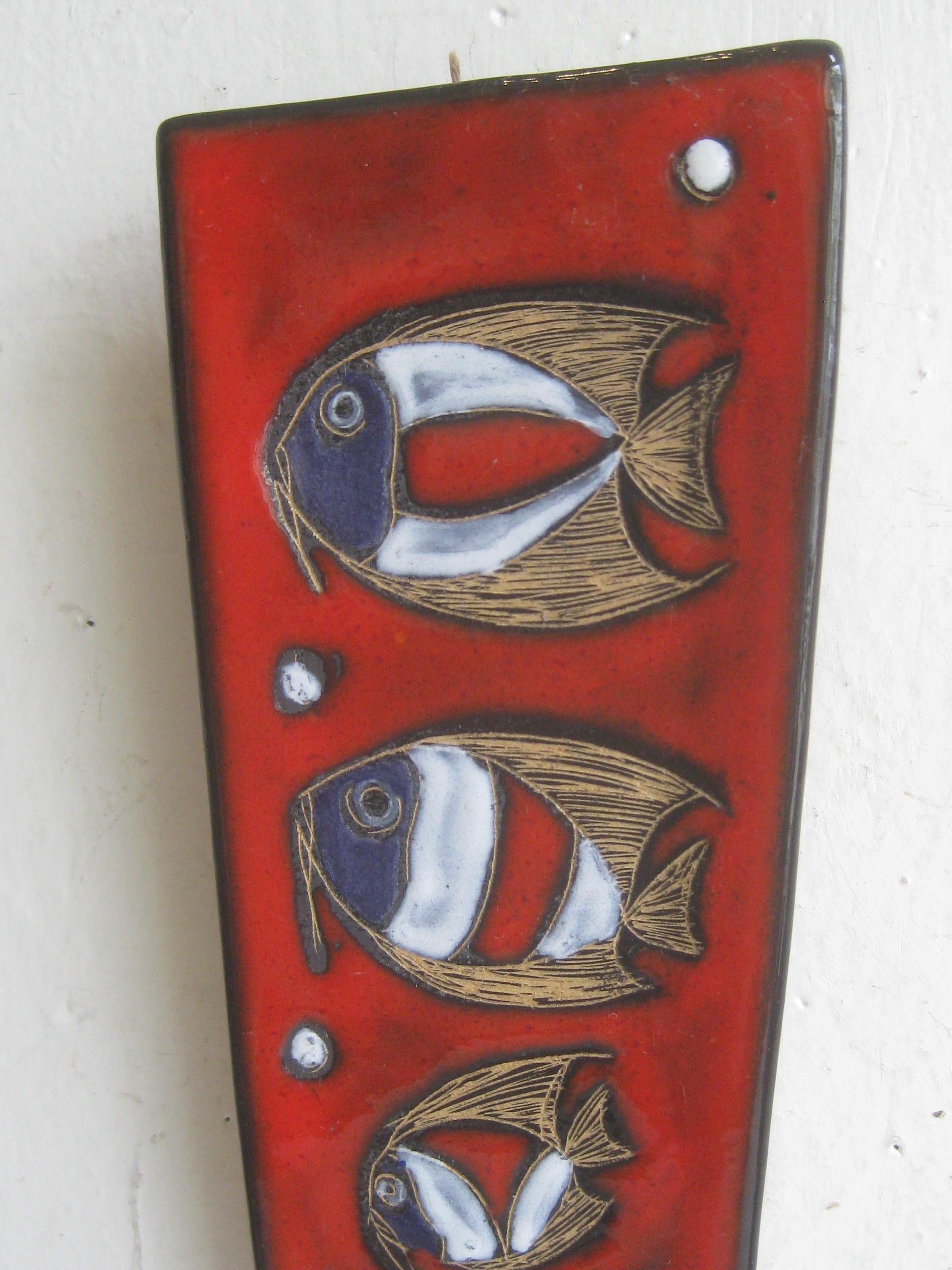 Stunning modernist Italian art pottery abstract wall plaque/sculpture by Franco Rufinelli and dates from the 1960s. Signed on the back and features 3 fish. Color and design are outstanding. In excellent shape for its age. No chips, no cracks and no