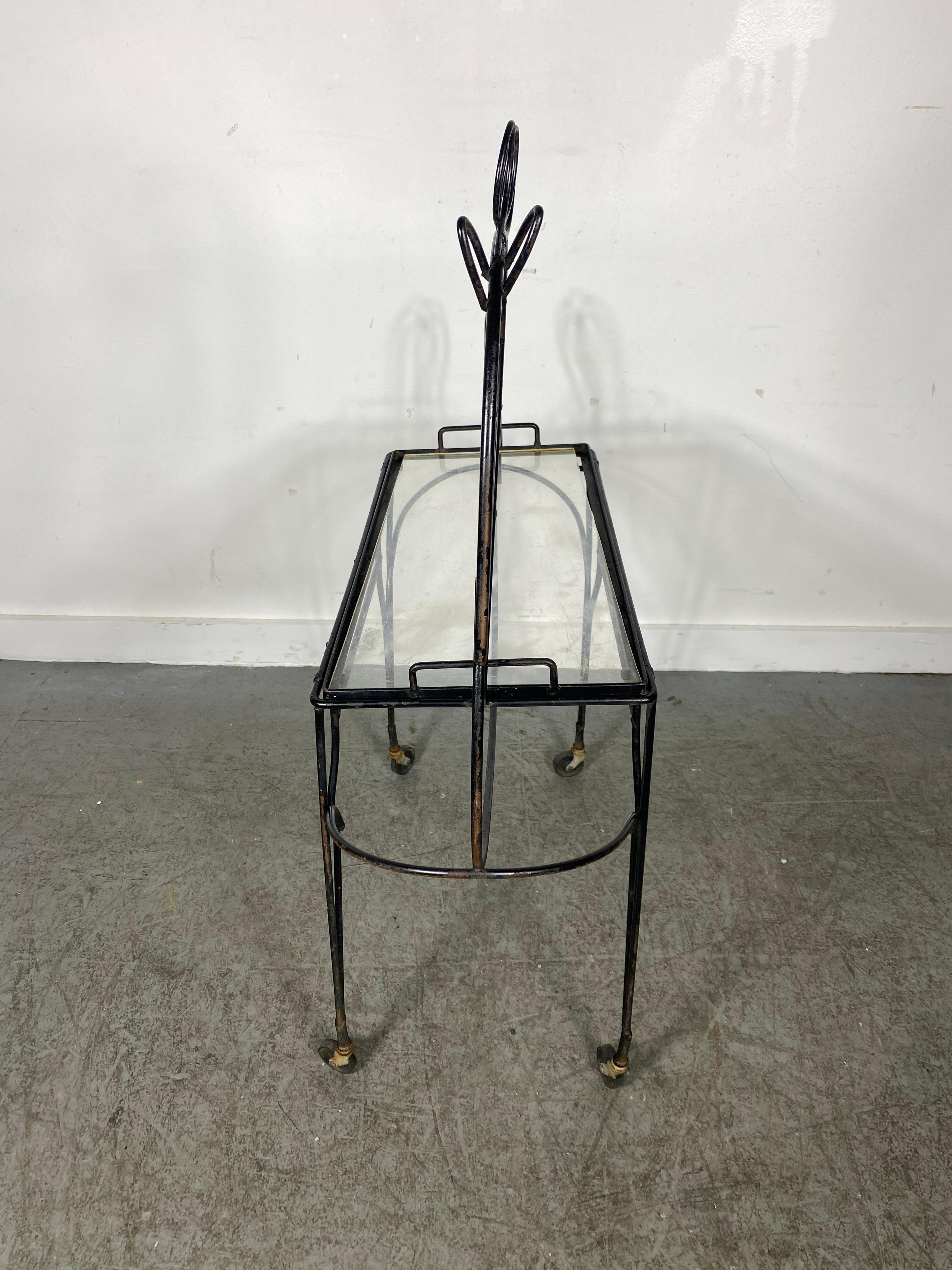 Whimsical Mid Century Black Horse Outline Bar Cart Designed By Frederick Weinberg in The 1950's.Removable serving tray, replaced plexiglass .Interior or exterior.. great garden , patio piece.. Hand delivery avail to New York city or anywhere en