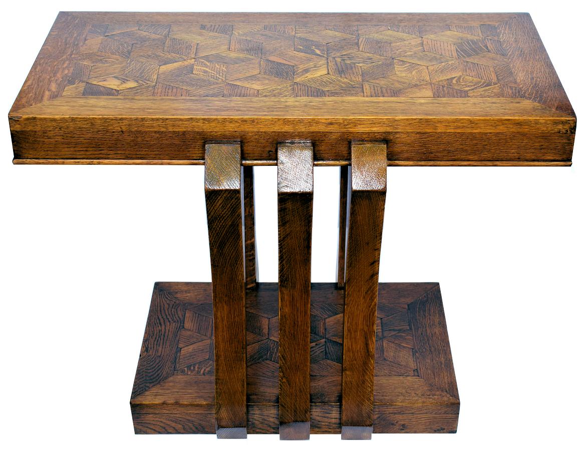 A most unusual modernist French Art Deco console table dating to the 1930s. It's constructed of oak with an inlaid top and base and is of very sturdy construction. This table is an ideal size for many uses including console table, hall table, end