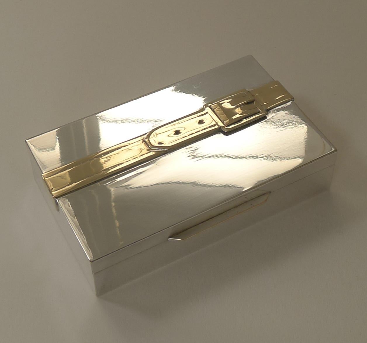 A highly collectable Mid-Century Modern / modernist box by French designer Maria Pergay in silver and gold plate.

The interior is signed and dated 1959. As seen in 